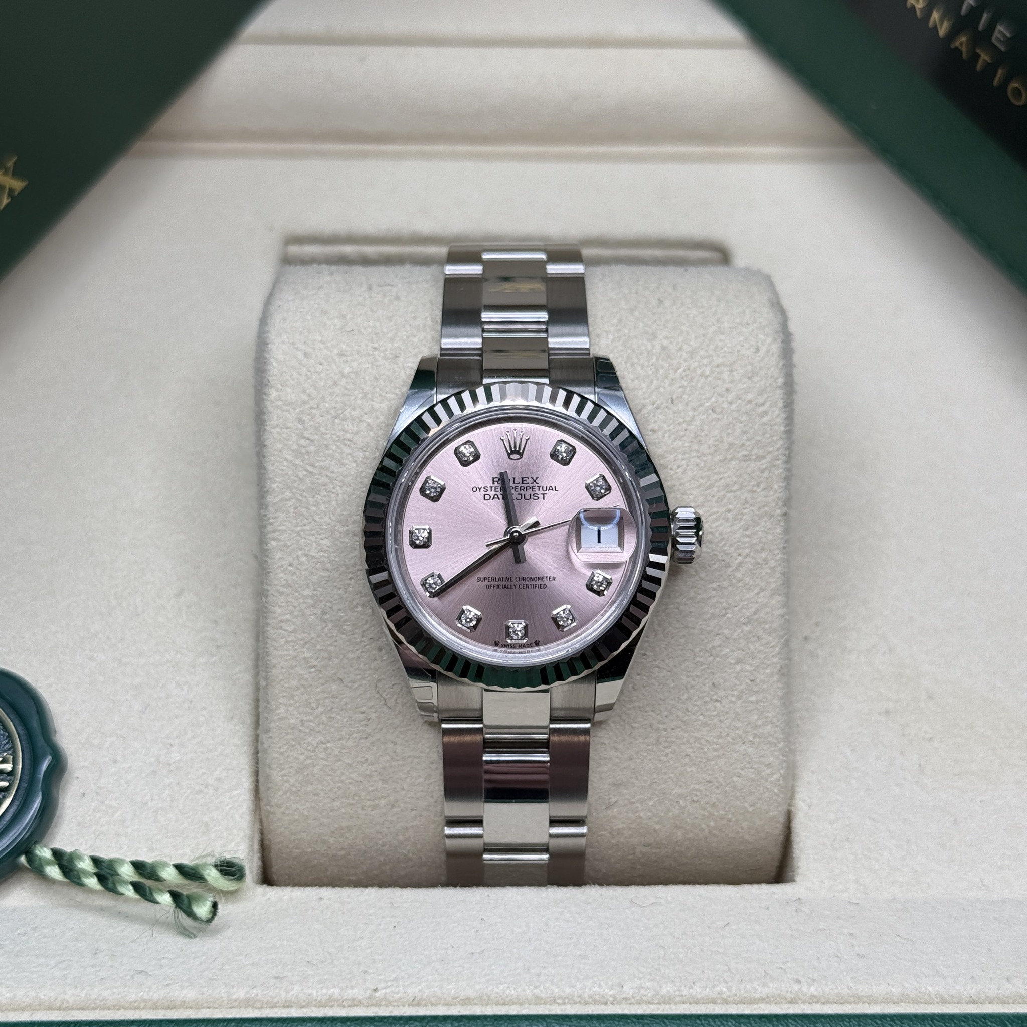 May be an image of wrist watch and text