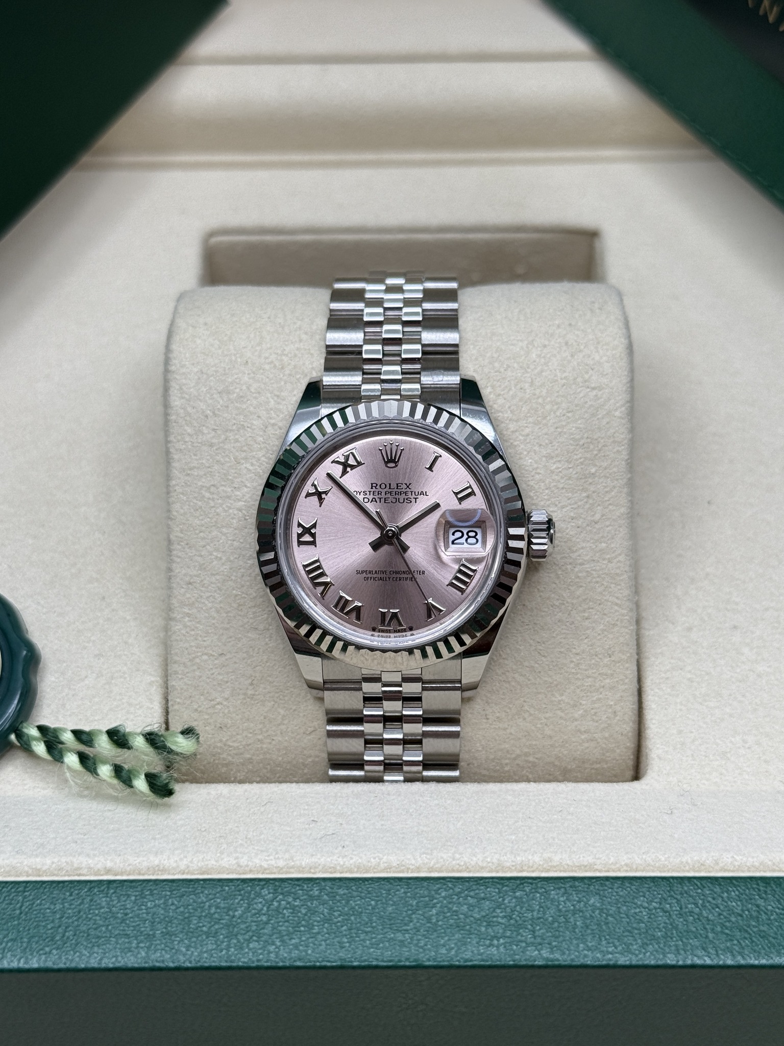 May be an image of wrist watch and text that says 'I II Sy LME വ y MST 165 IX III d- 11 28 28 um IIII -'