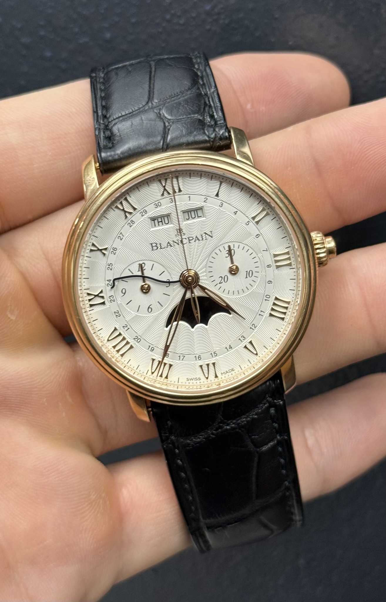 May be an image of wrist watch and text