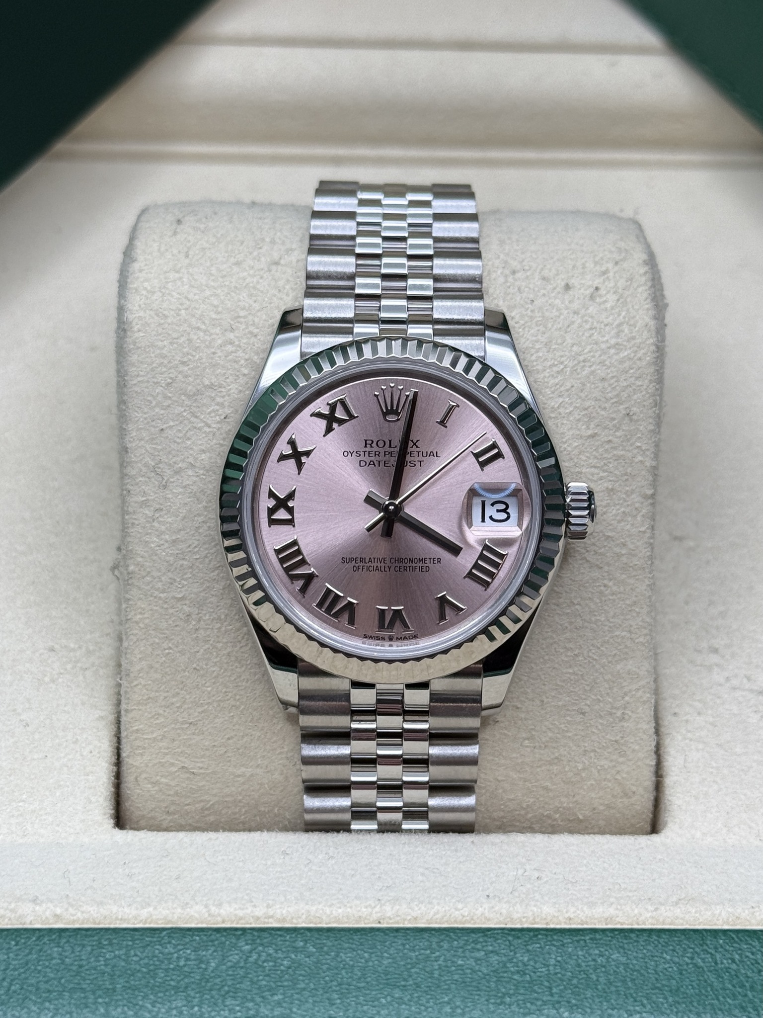 May be an image of wrist watch and text that says 'فت TUAL A ST I II XI y X OYS OYSTE DA IX ΓЛωή II 13 III AI ١'
