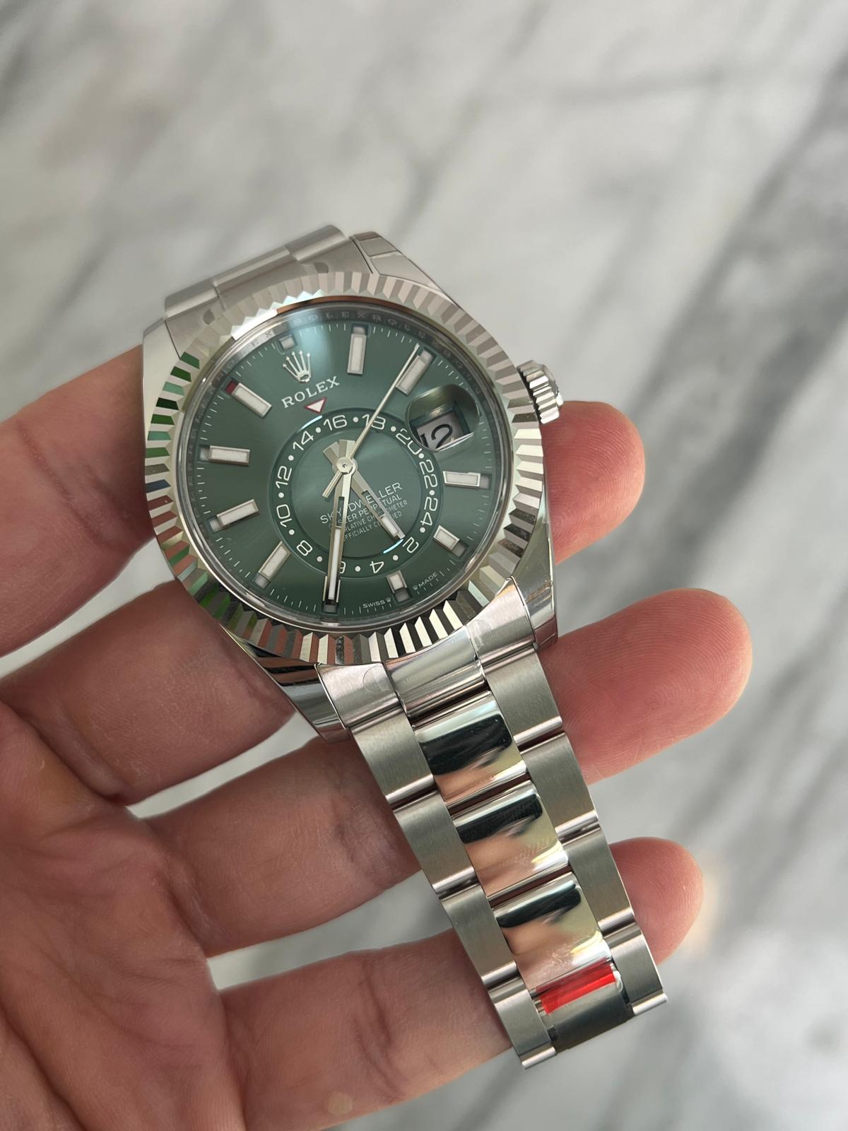 May be an image of wrist watch and text