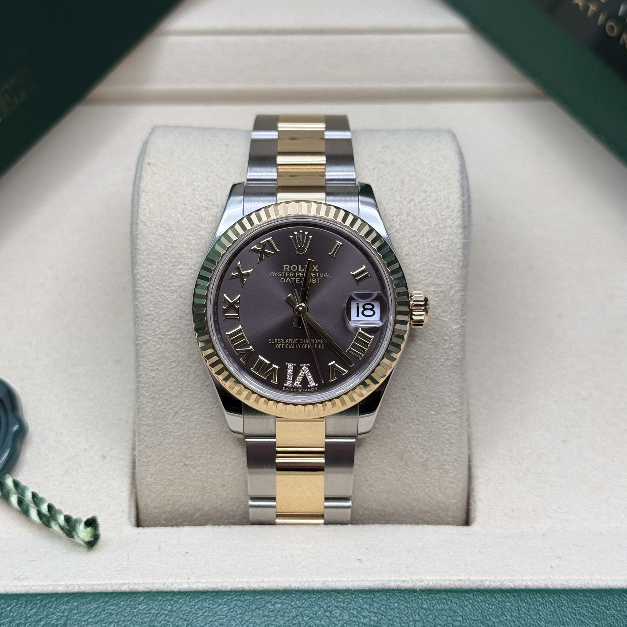 May be an image of wrist watch and text