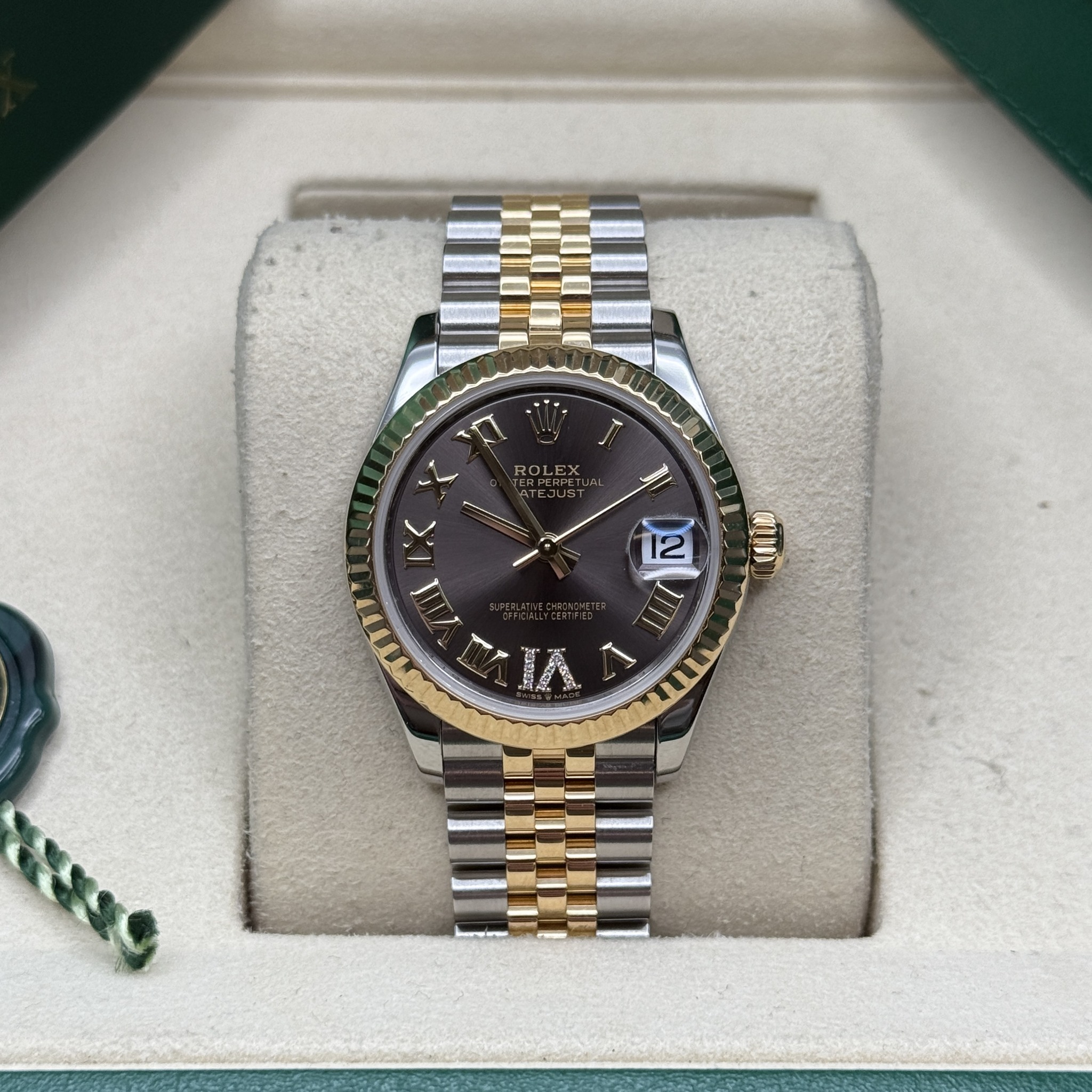 May be an image of wrist watch and text