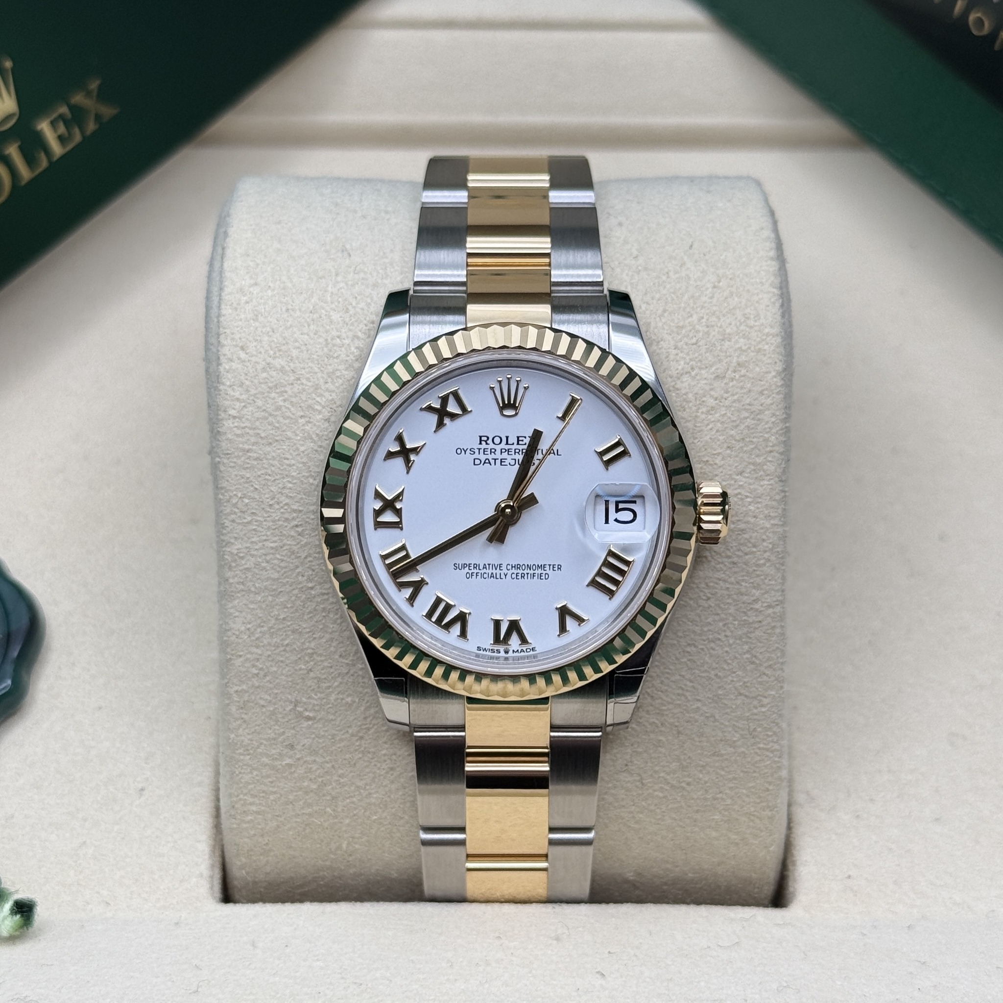 May be an image of wrist watch and text