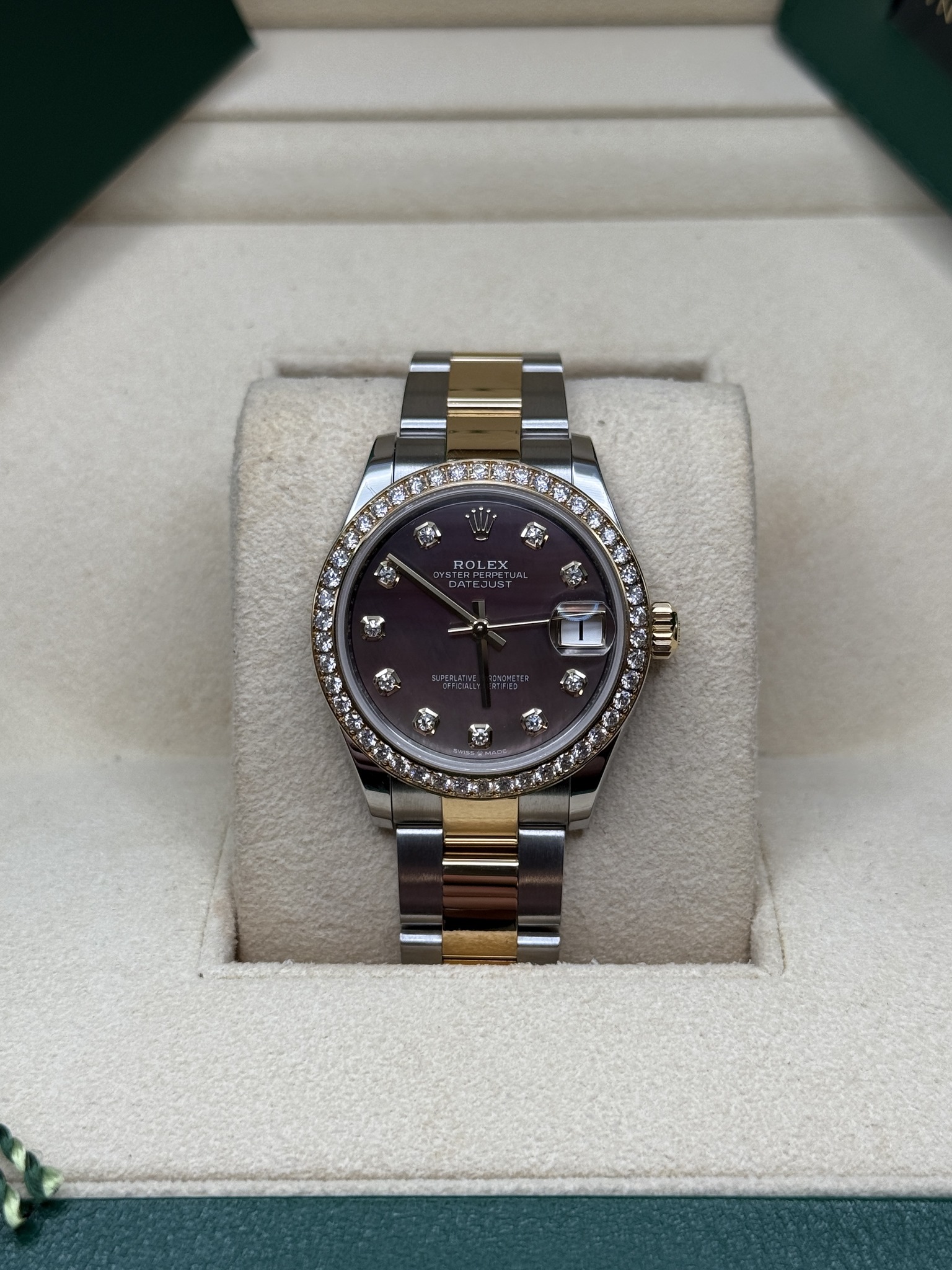 May be an image of wrist watch and text