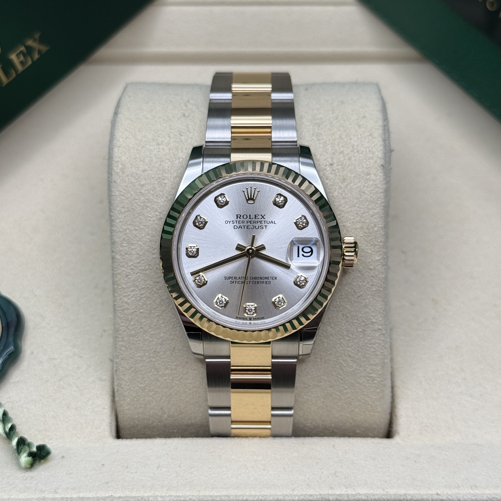 May be an image of wrist watch and text