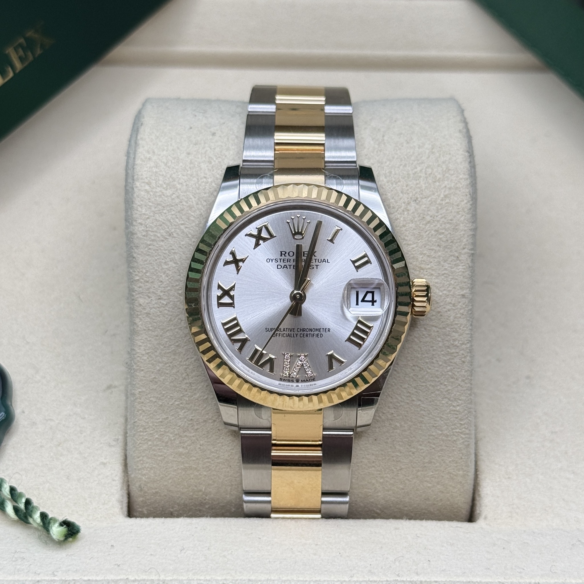 May be an image of wrist watch and text