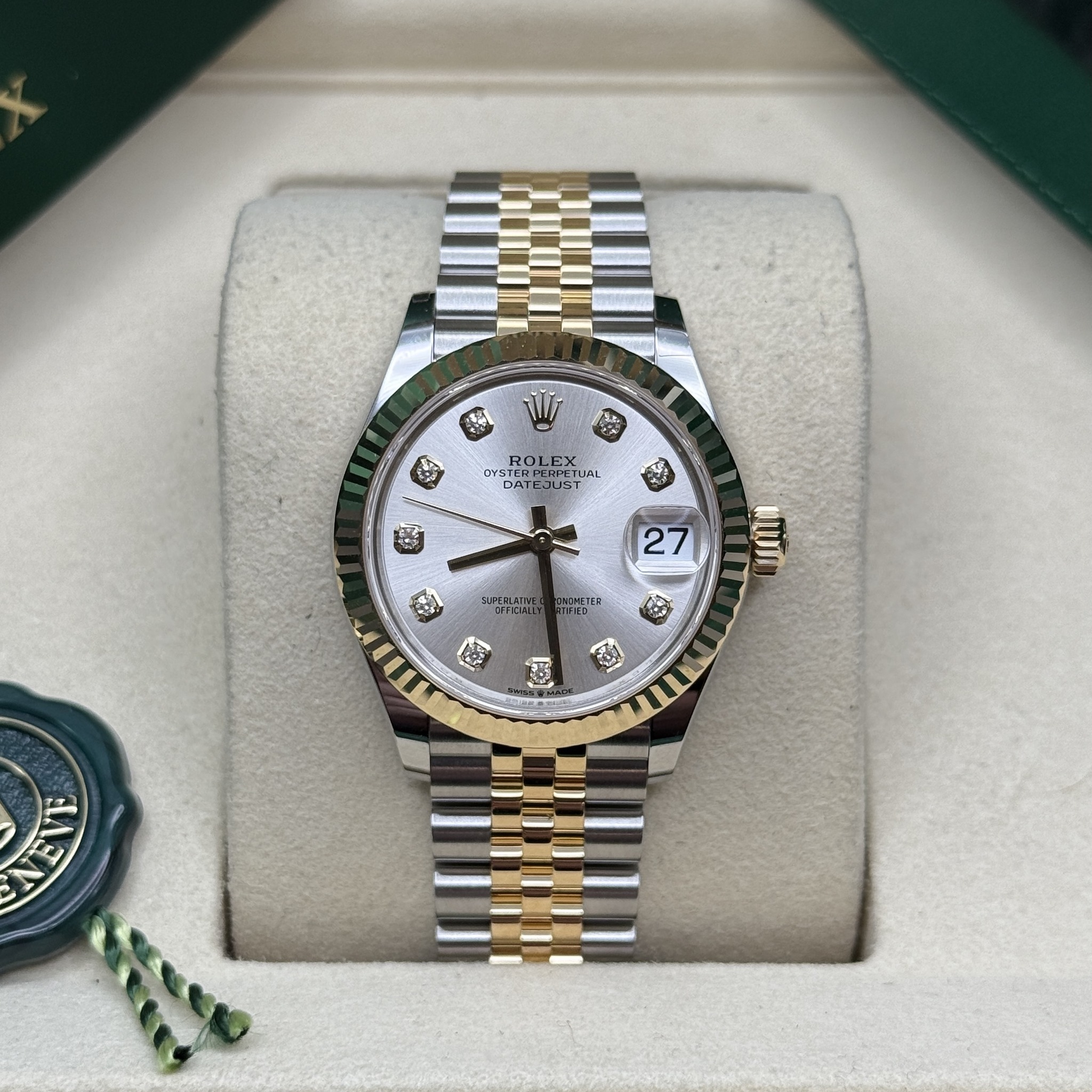 May be an image of wrist watch and text