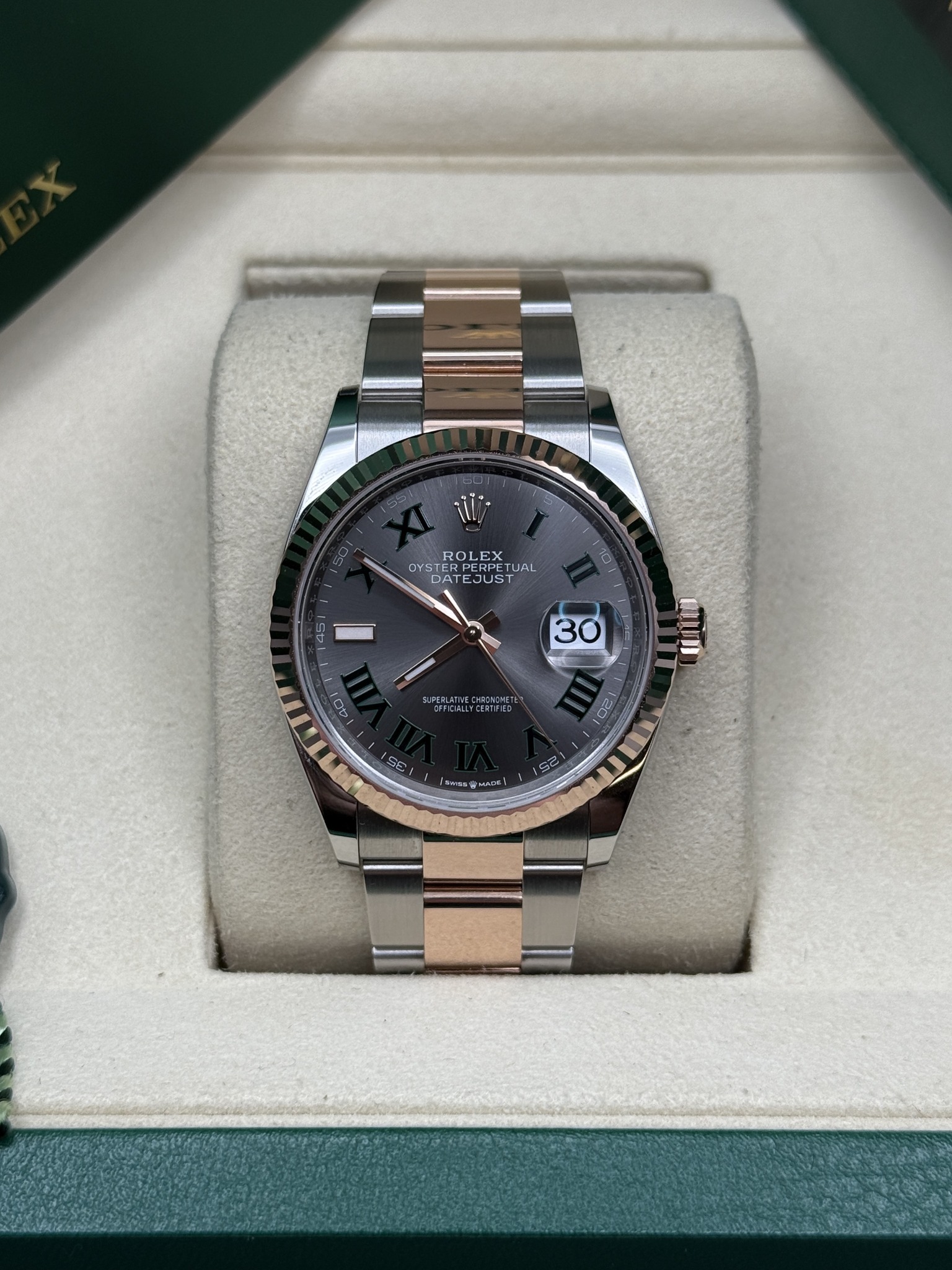 May be an image of wrist watch and text