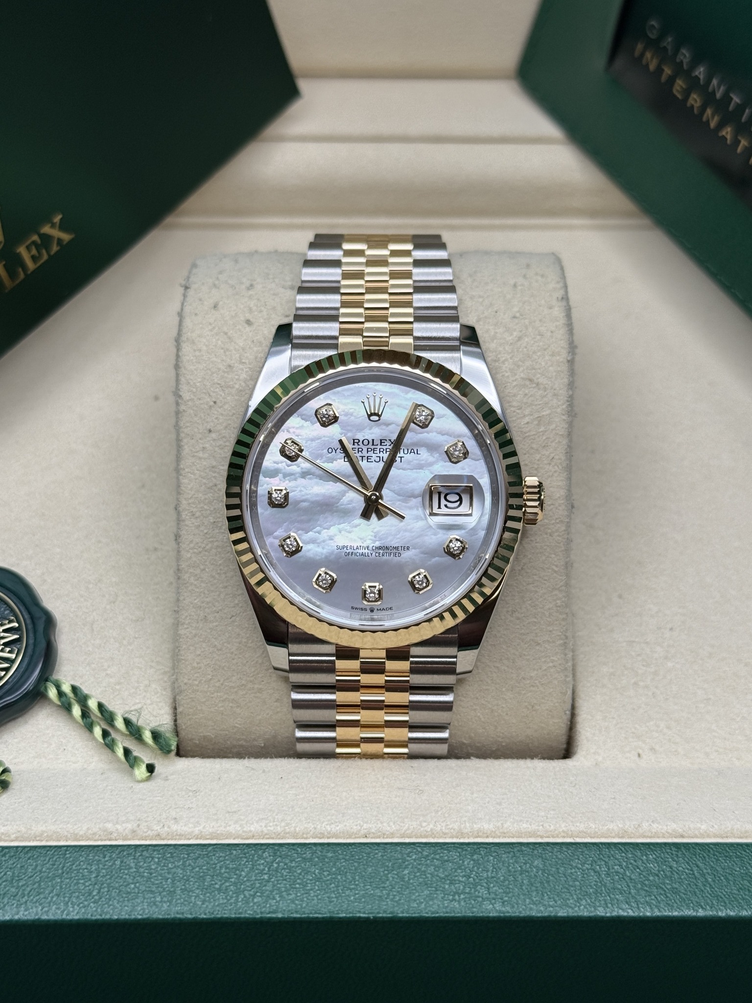 May be an image of wrist watch and text