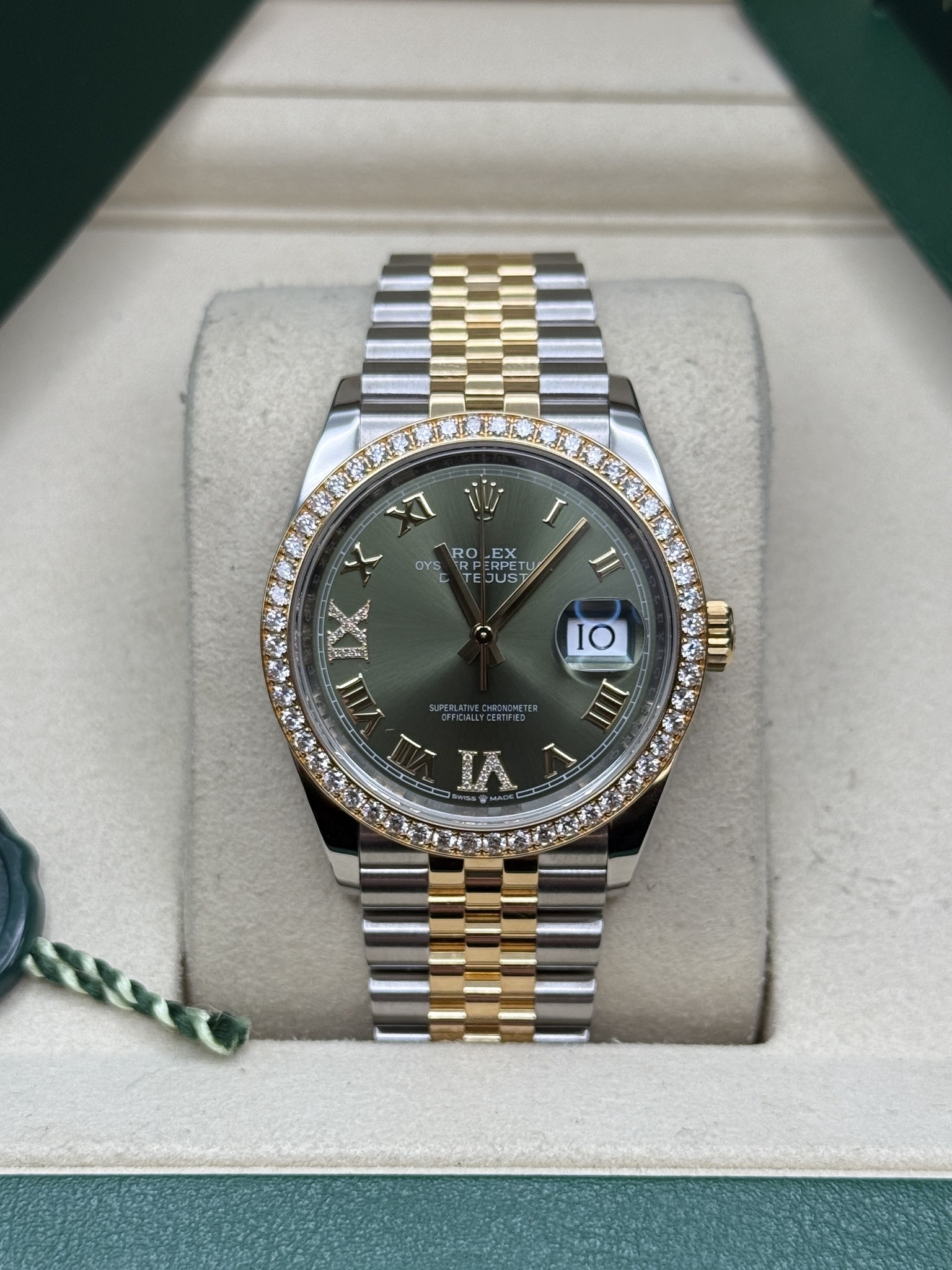 May be an image of wrist watch and text