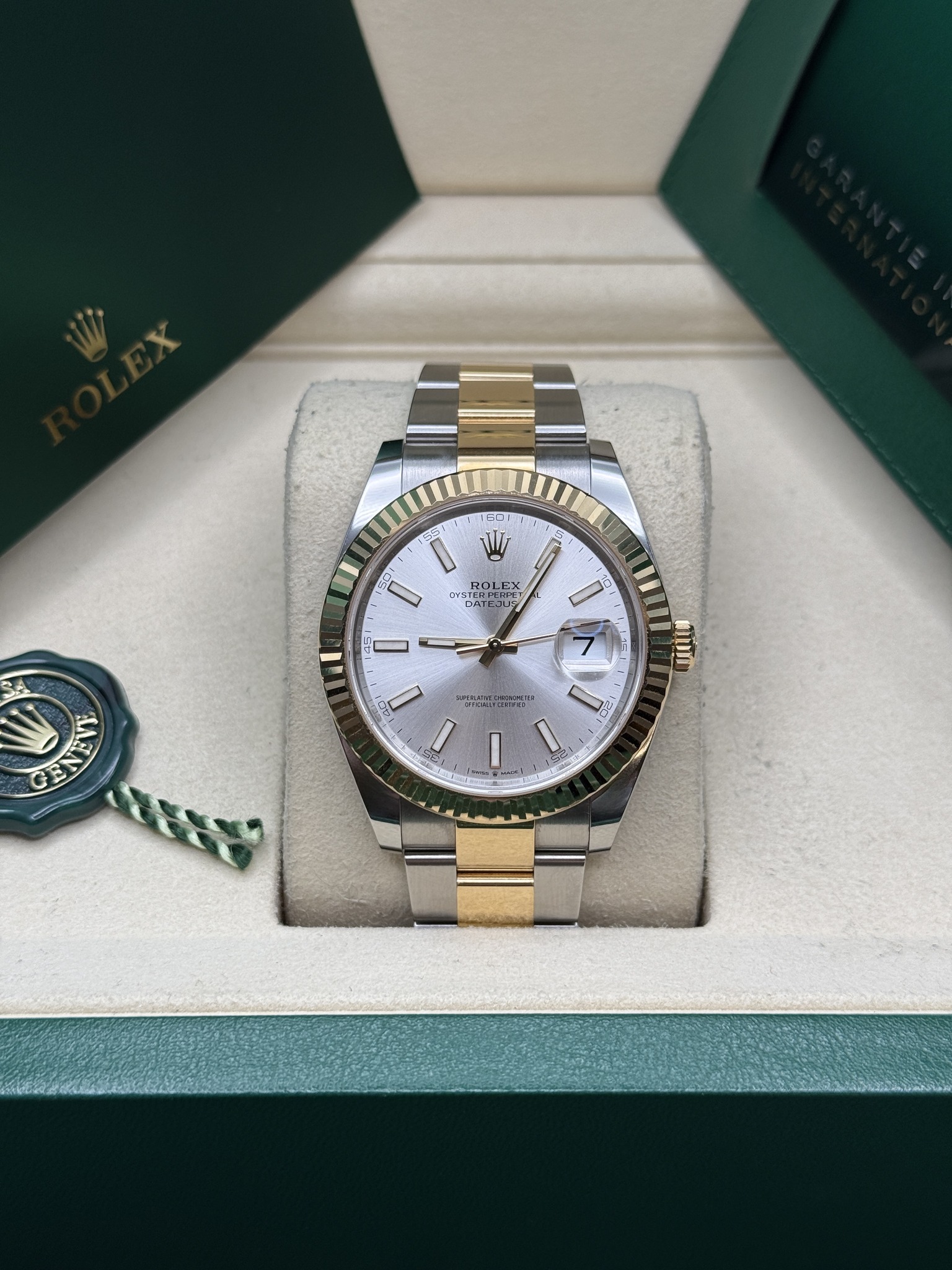 May be an image of wrist watch and text