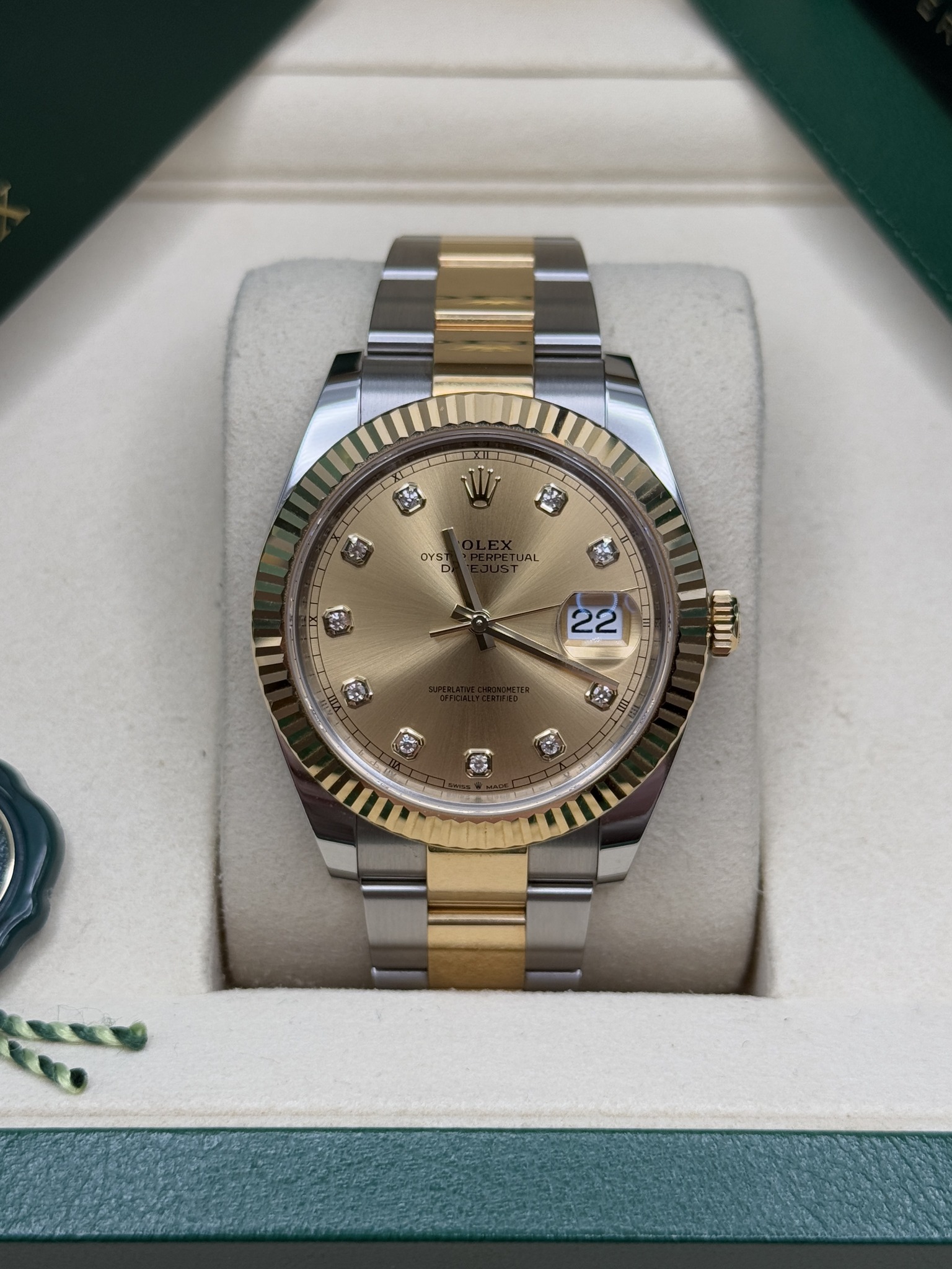 May be an image of wrist watch and text