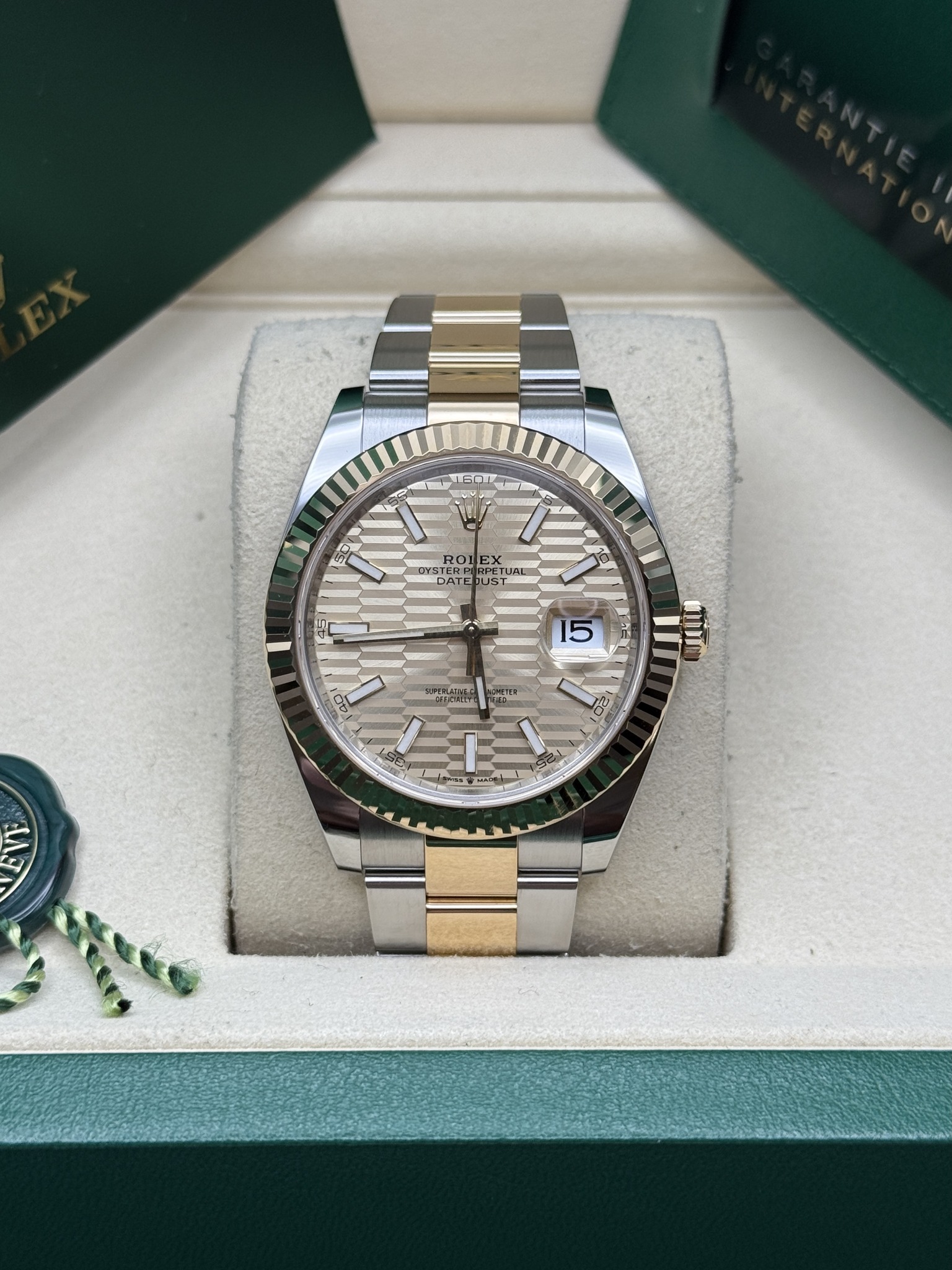 May be an image of wrist watch and text