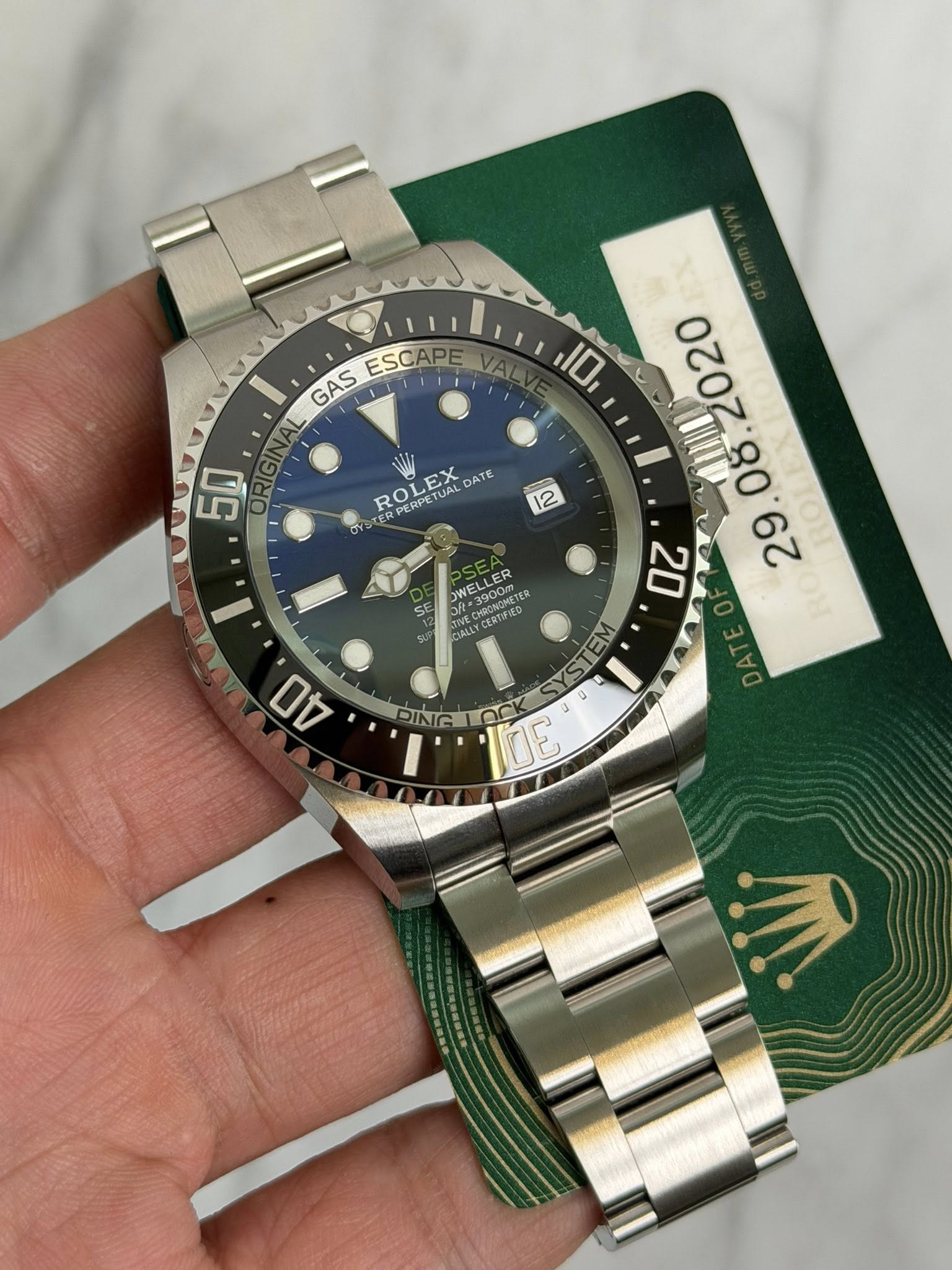 May be an image of wrist watch and text