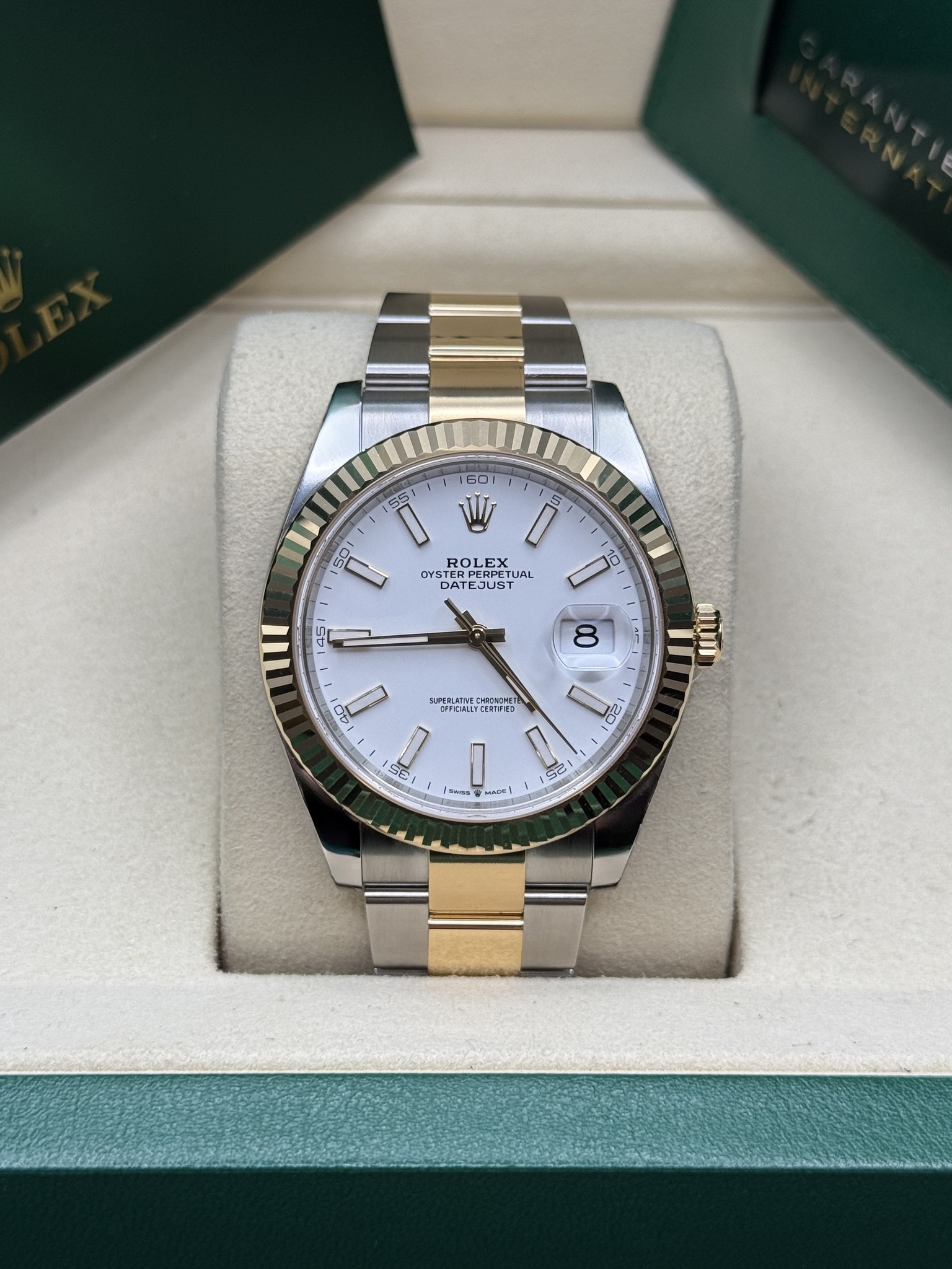 May be an image of wrist watch and text