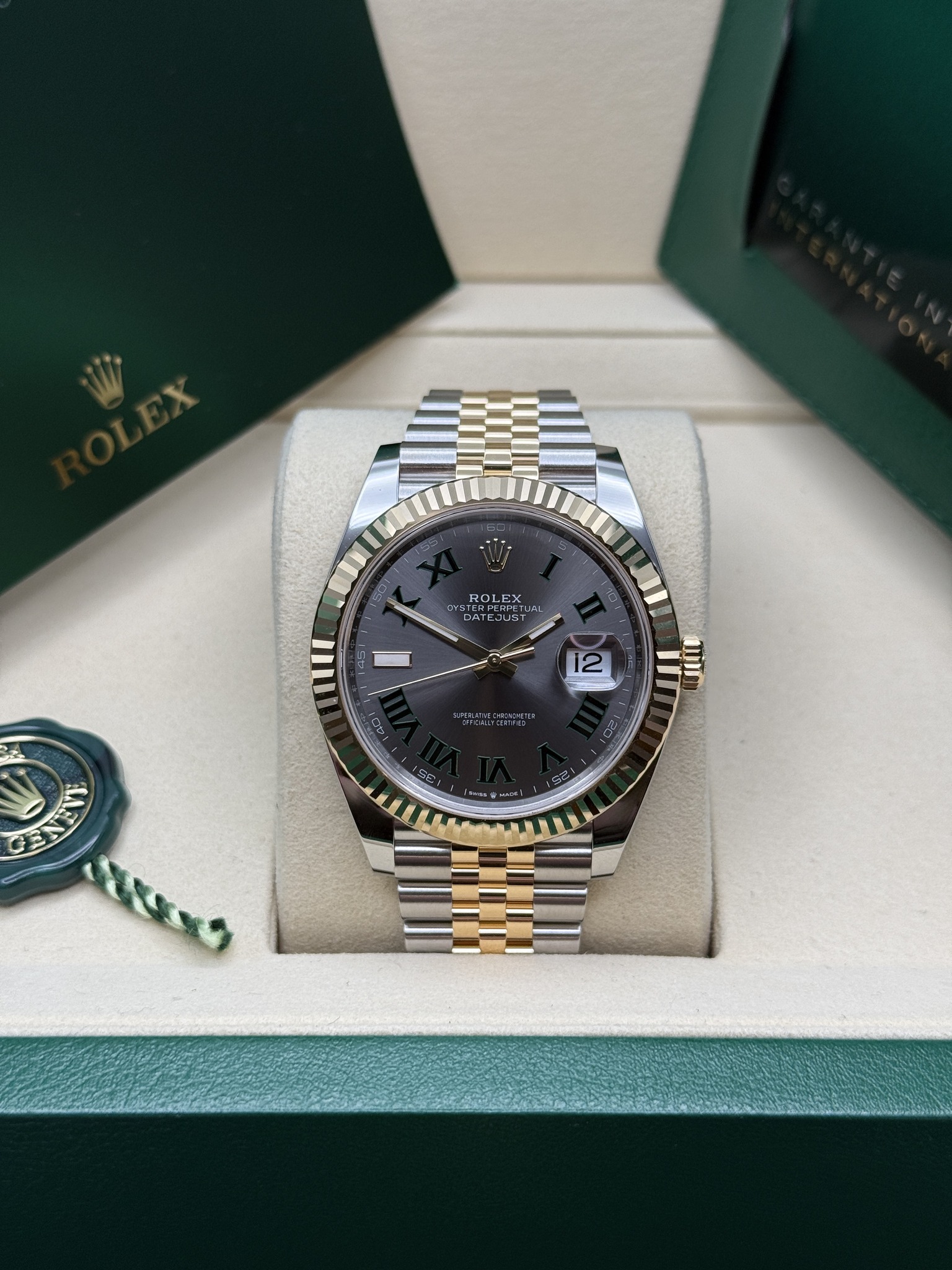 May be an image of wrist watch and text