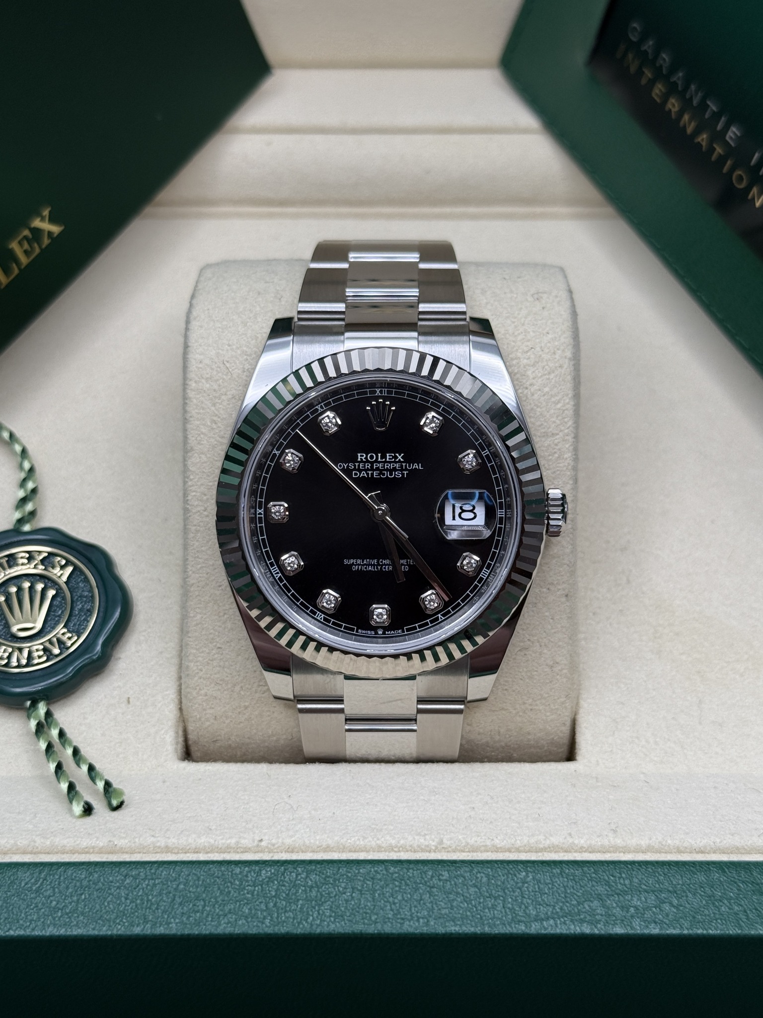 May be an image of wrist watch and text