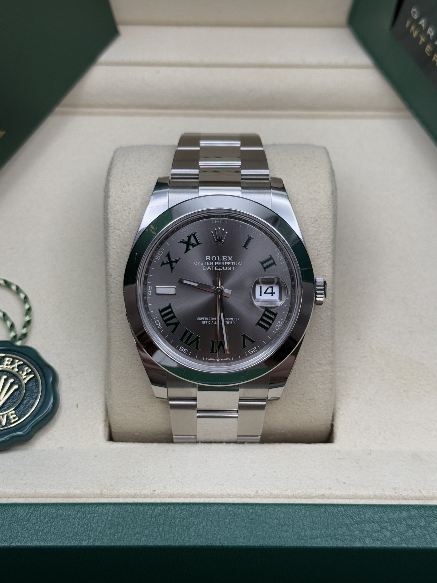 May be an image of wrist watch and text