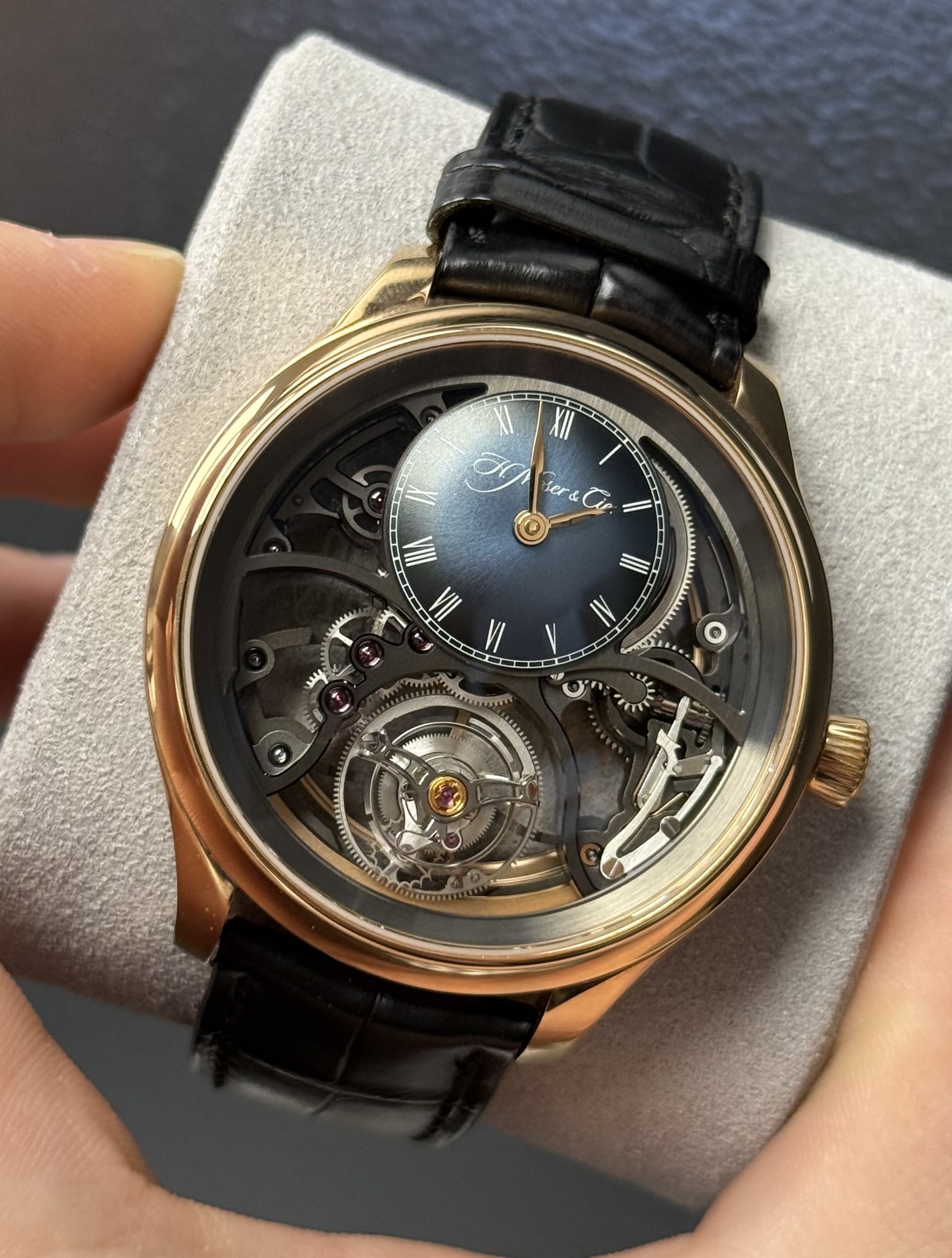 May be an image of wrist watch and text that says 'er& I IIA VI II IV O'