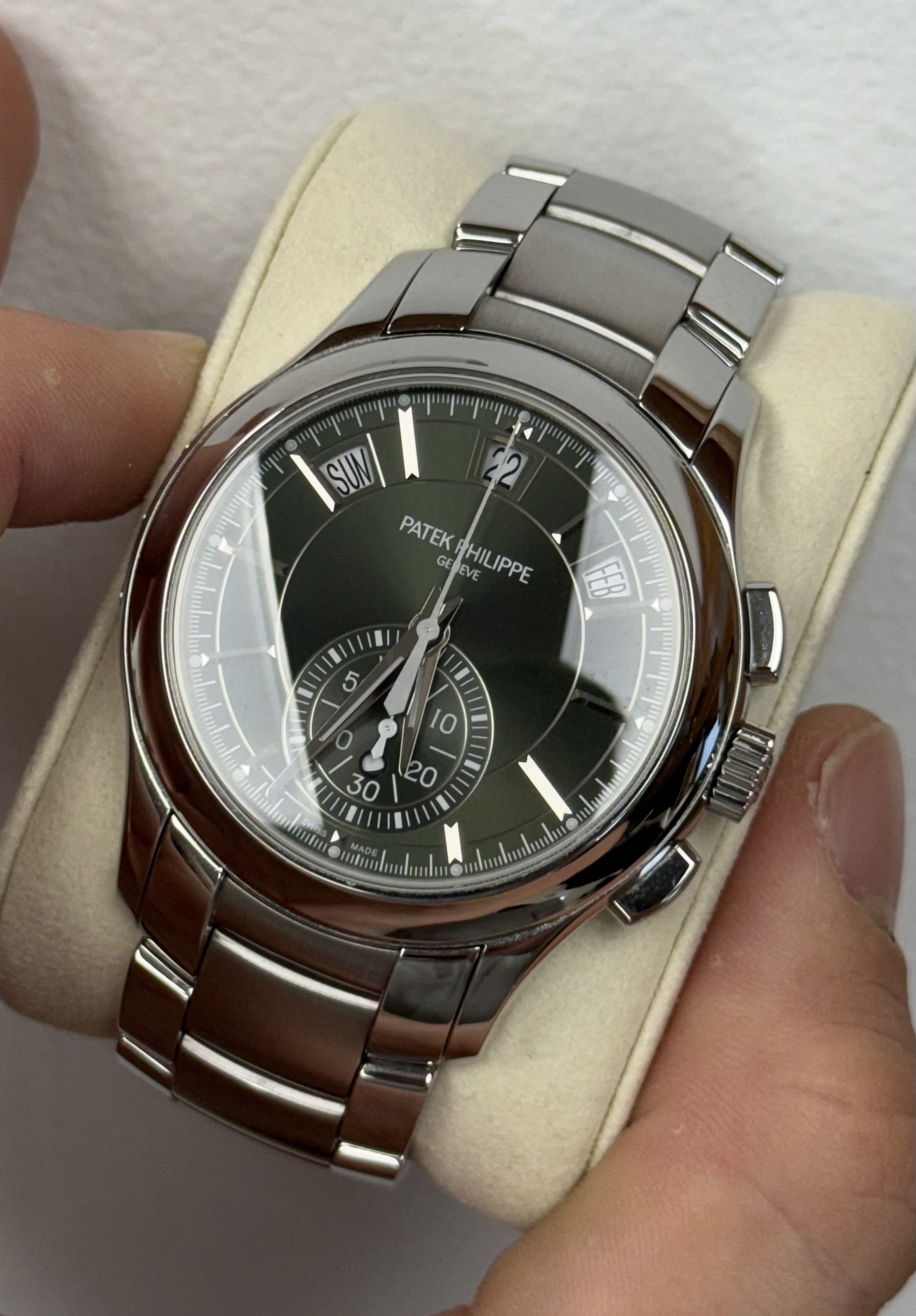 May be an image of wrist watch and text