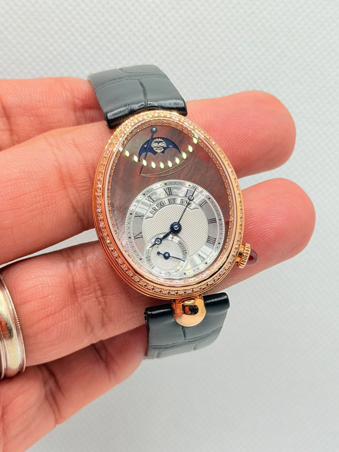 May be an image of wrist watch and text