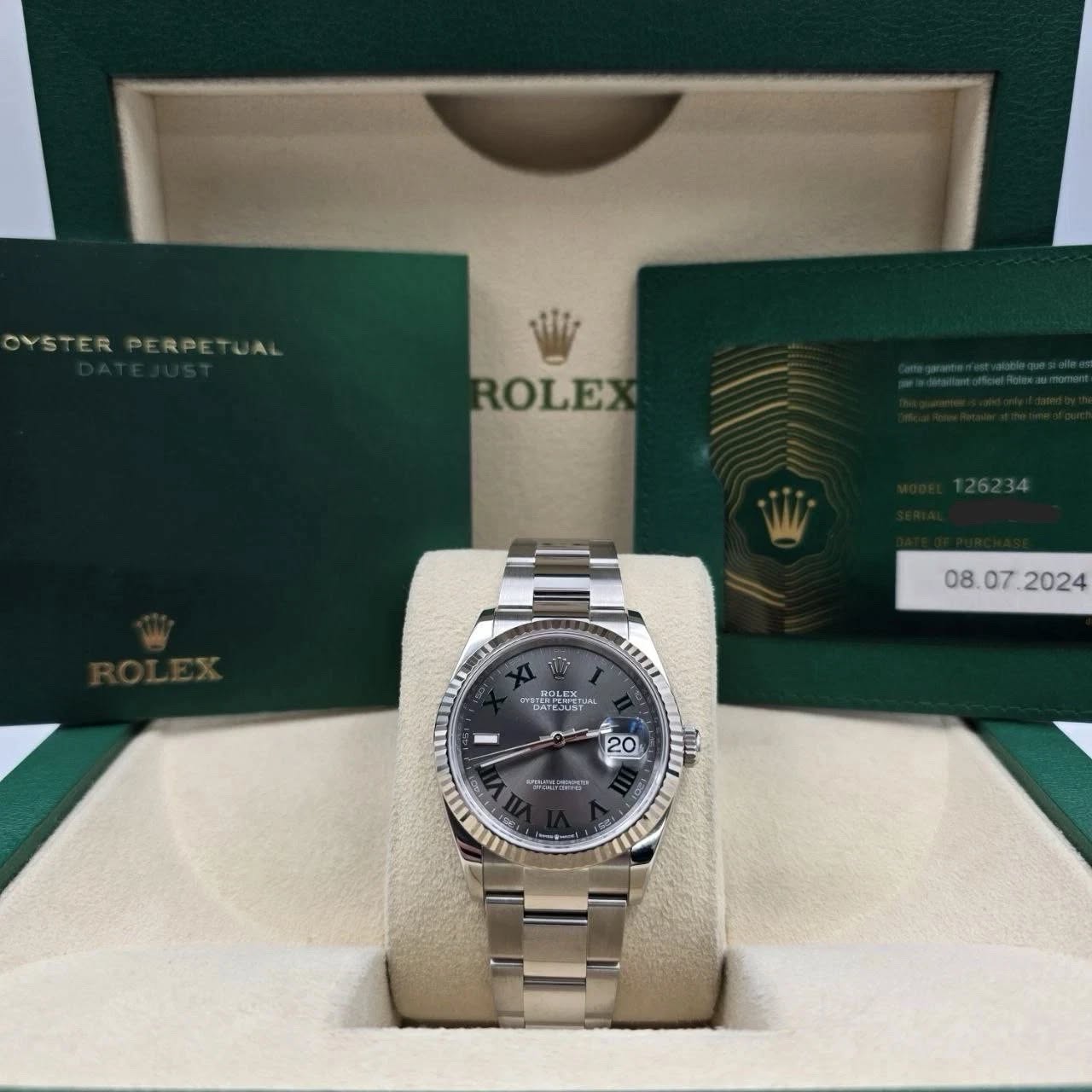 May be an image of wrist watch and text