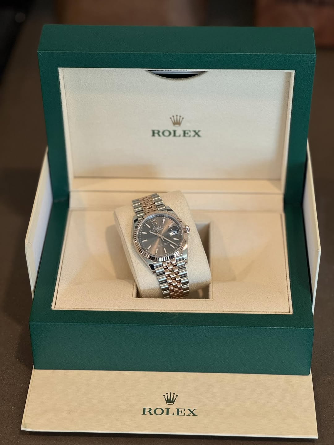 May be an image of wrist watch and text