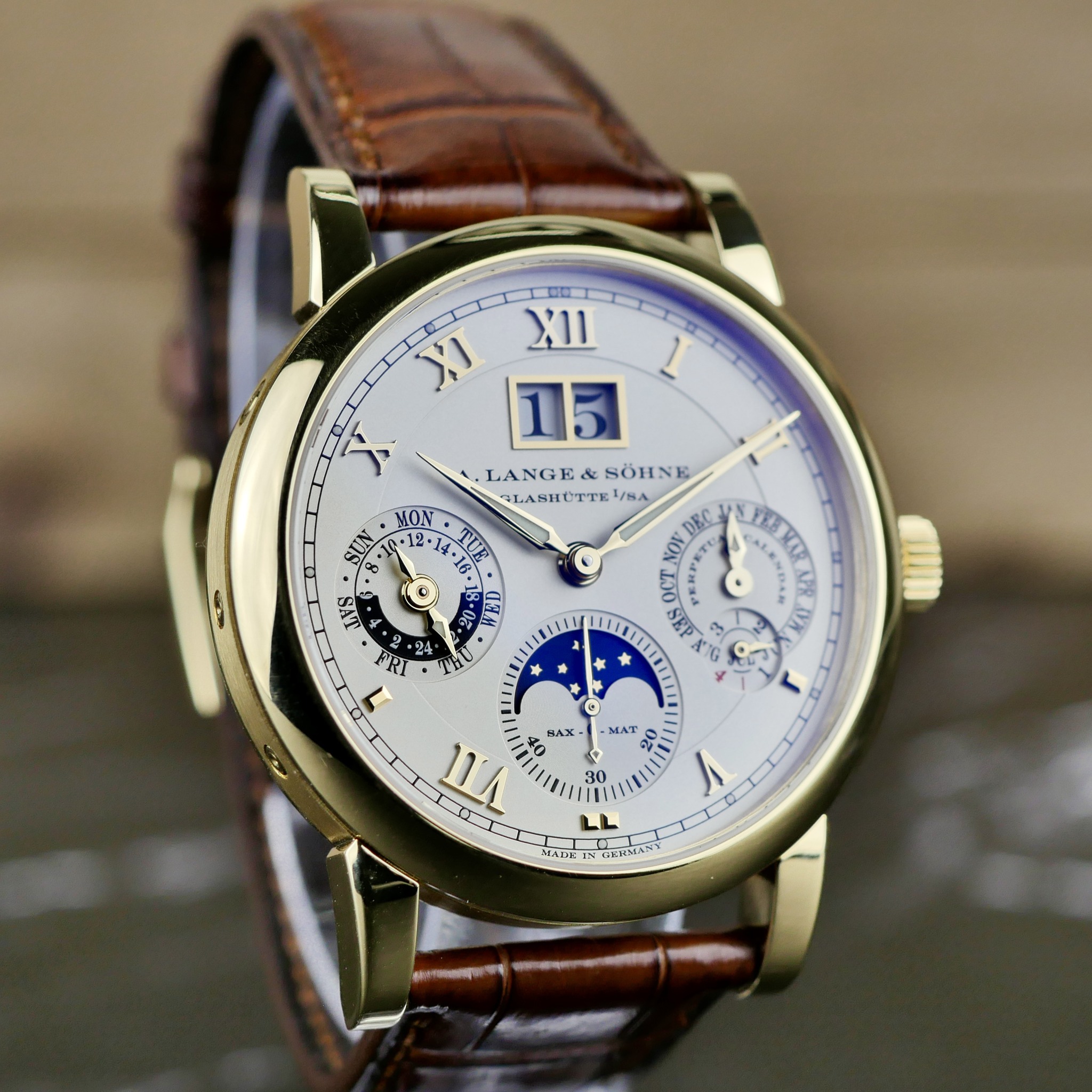May be an image of wrist watch and text