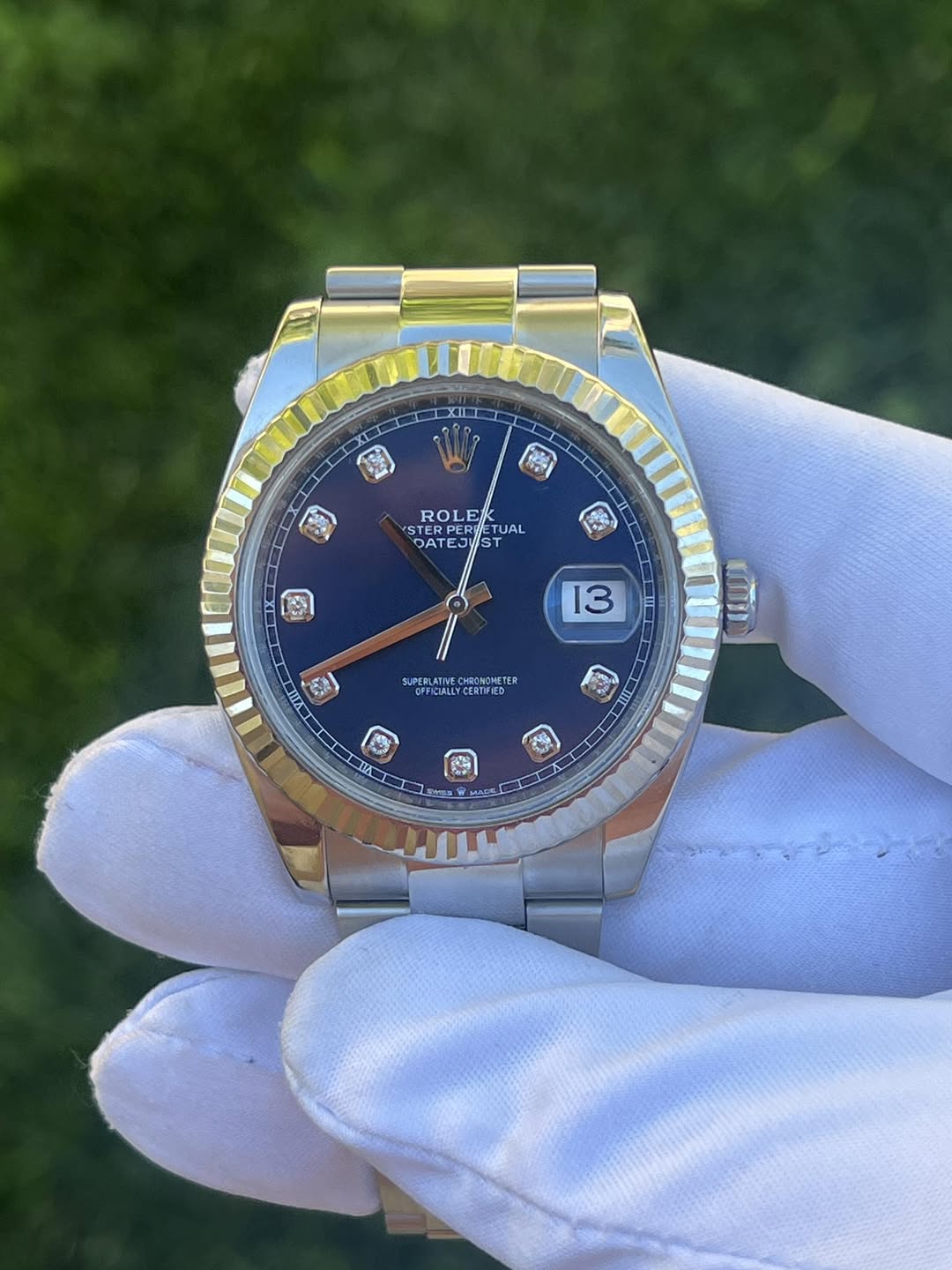 May be an image of wrist watch and text