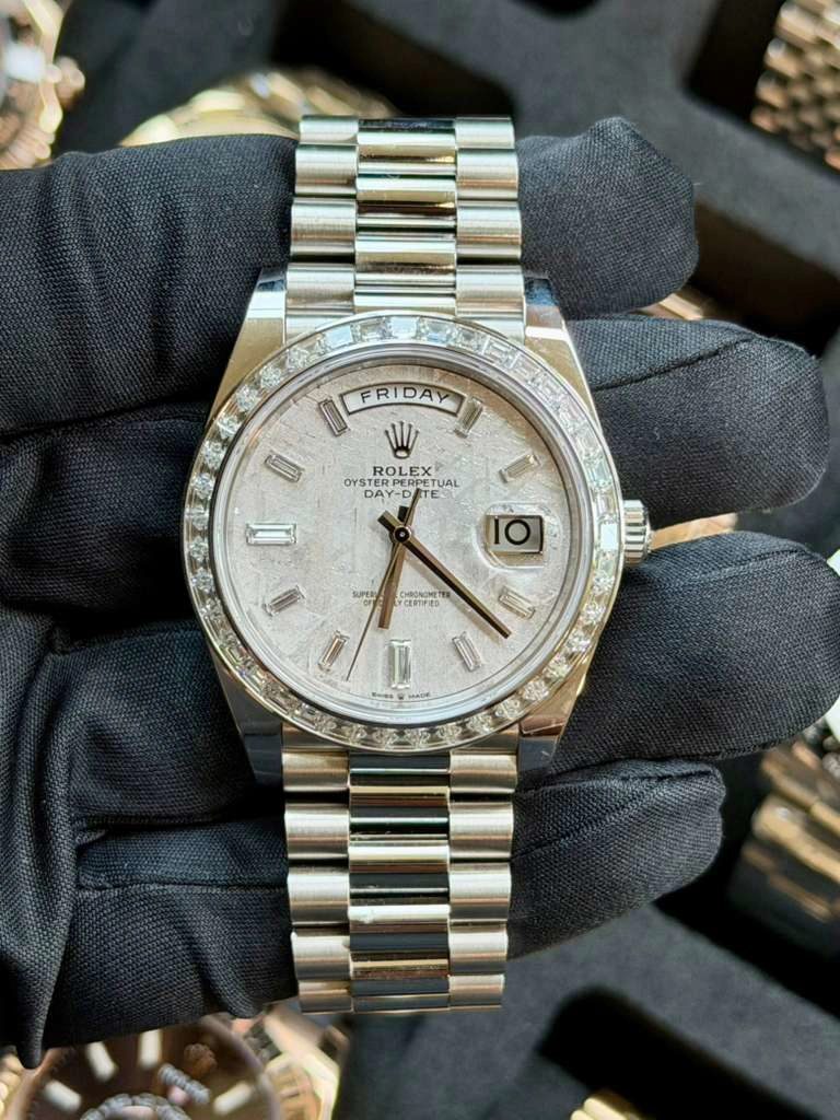 May be an image of wrist watch and text