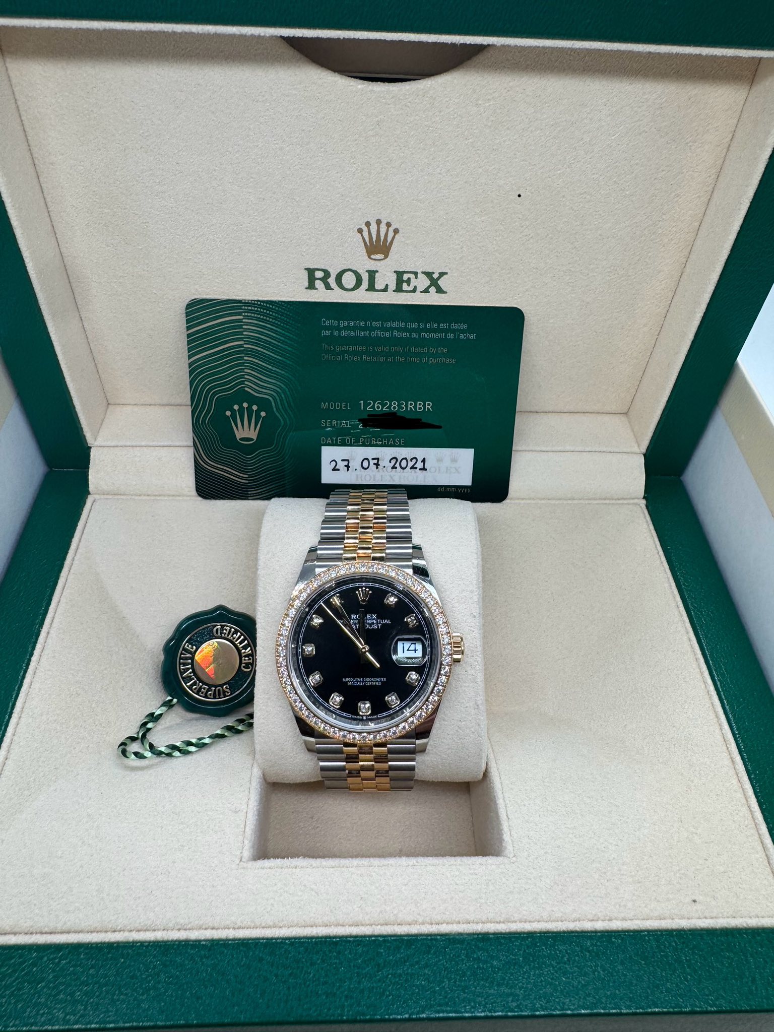 May be an image of wrist watch and text