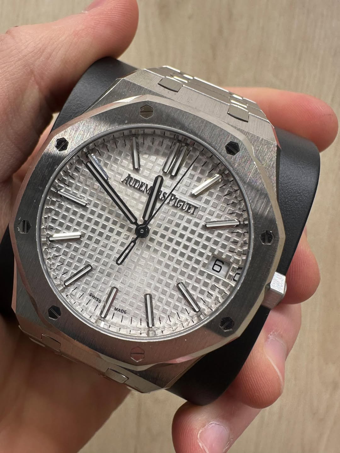 May be an image of wrist watch and text