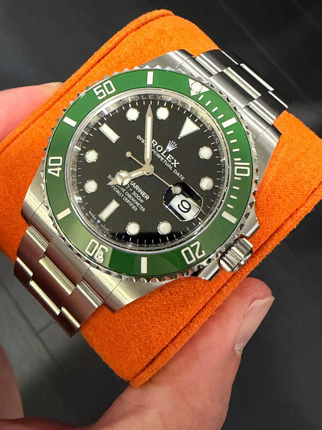 May be an image of wrist watch and text