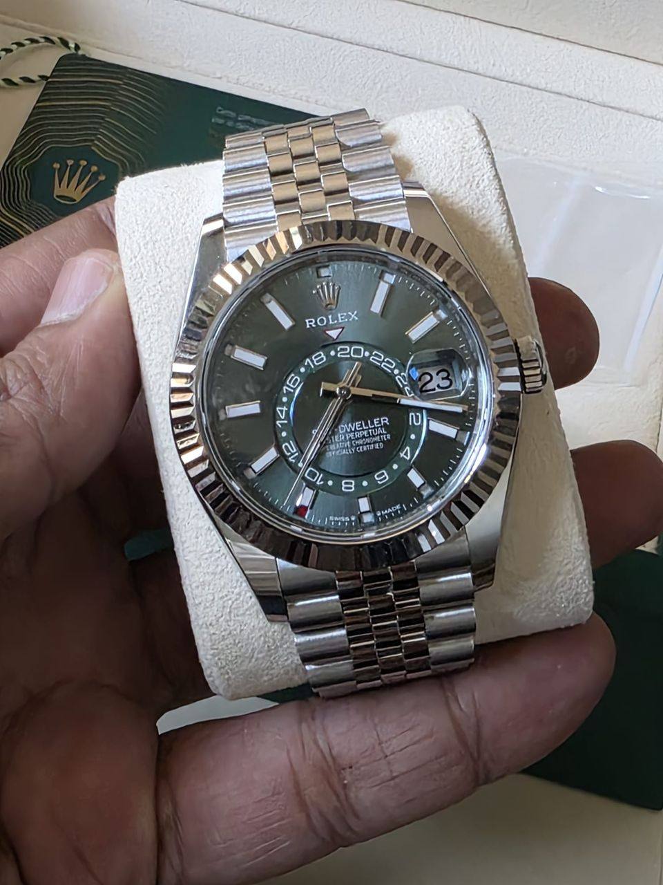 May be an image of wrist watch and text