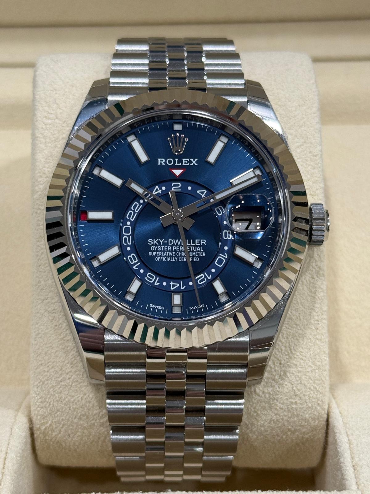May be an image of wrist watch and text that says 'ROLEX 4 2 22 O3. በ SKY-DWILLER OYSTER PERI ETUAL SKY-DWI DWL LLER SKY- O SUPERLATIV OYSTERPERI TEMB RCI0M BLION IOMETE OMETE SUPE…
