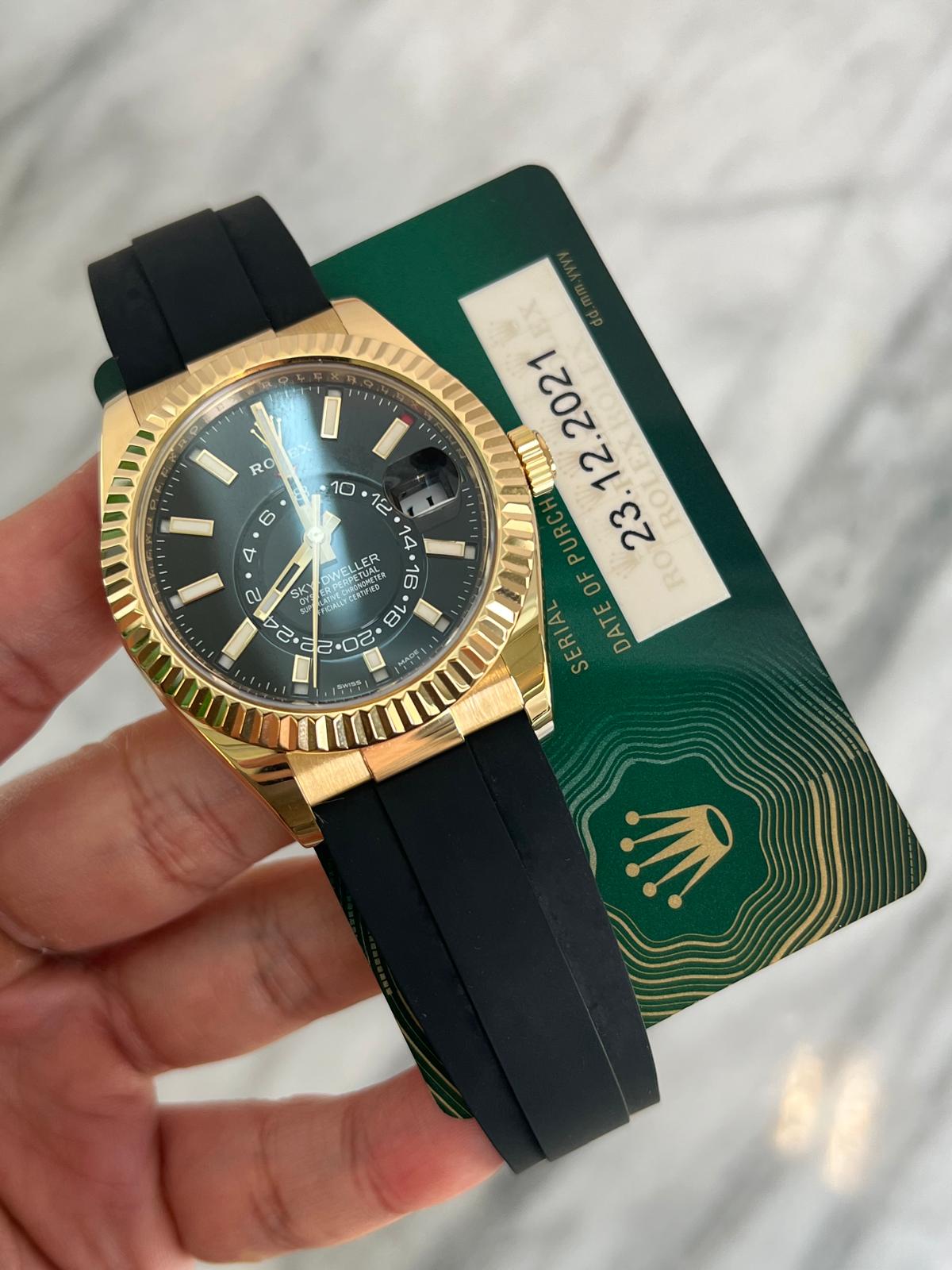 May be an image of wrist watch and text