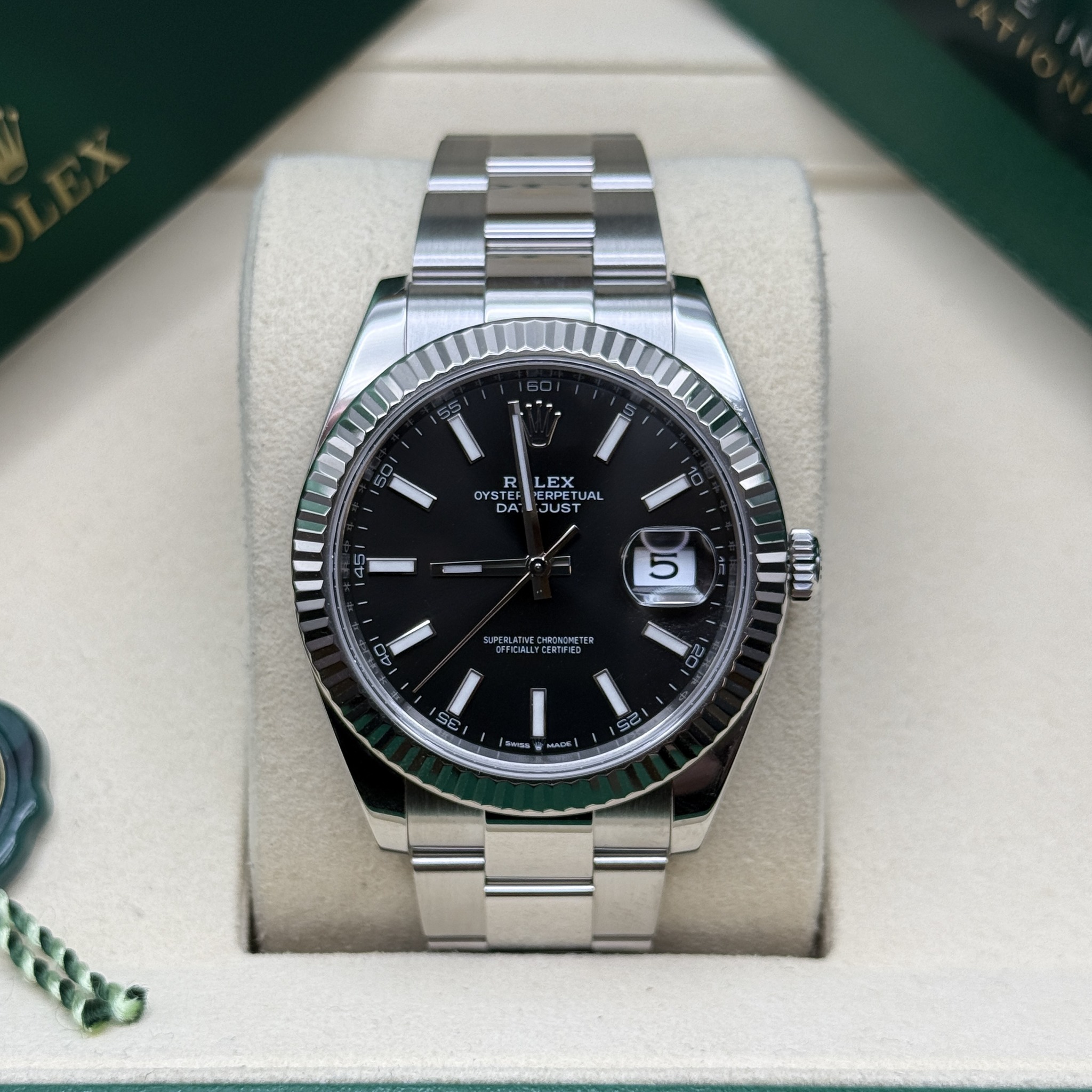 May be an image of wrist watch and text