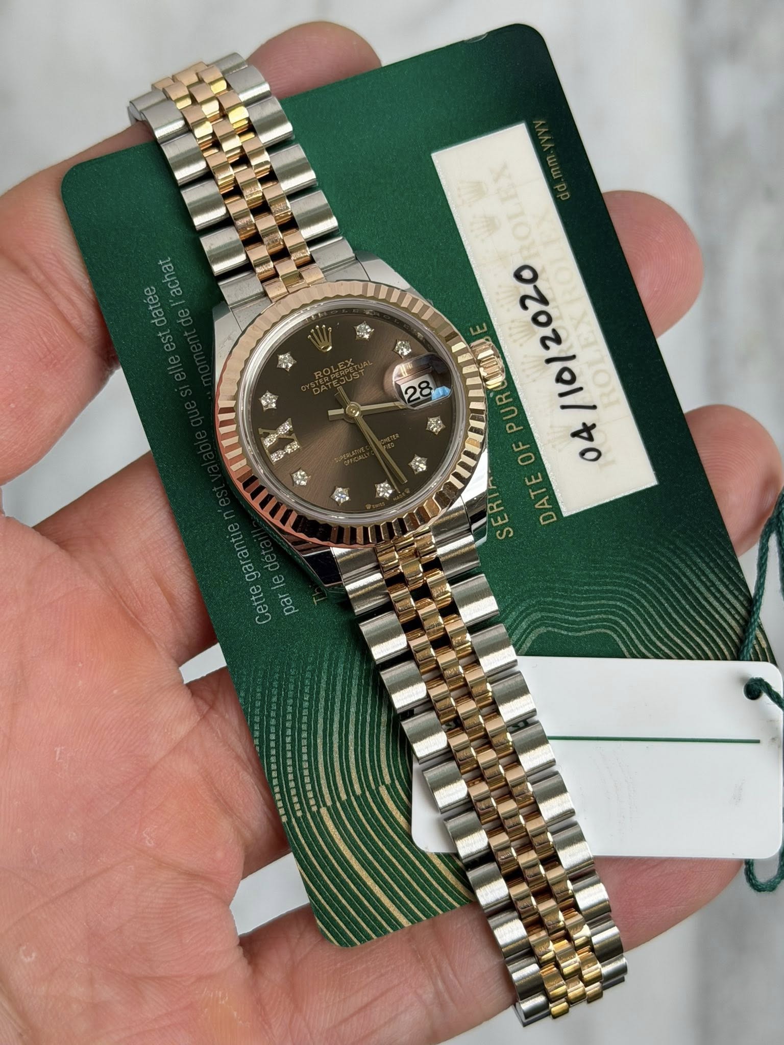 May be an image of wrist watch and text