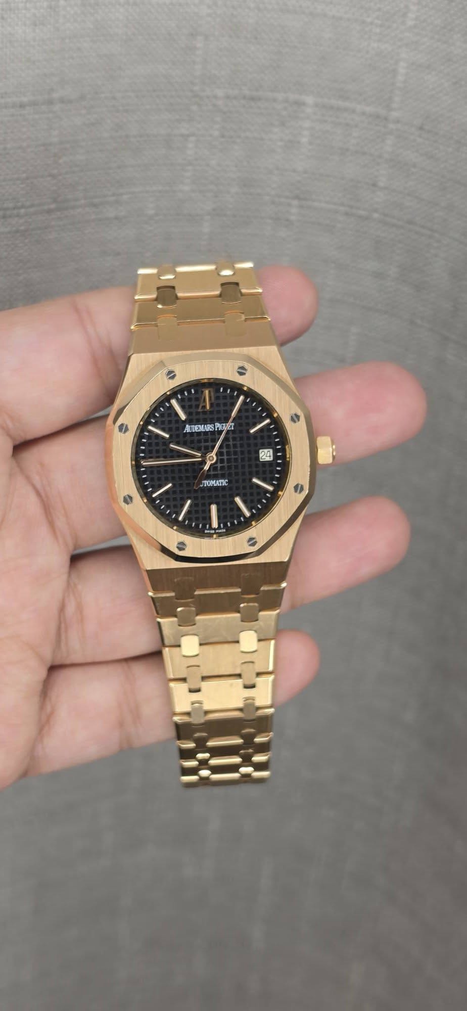 May be an image of wrist watch and text