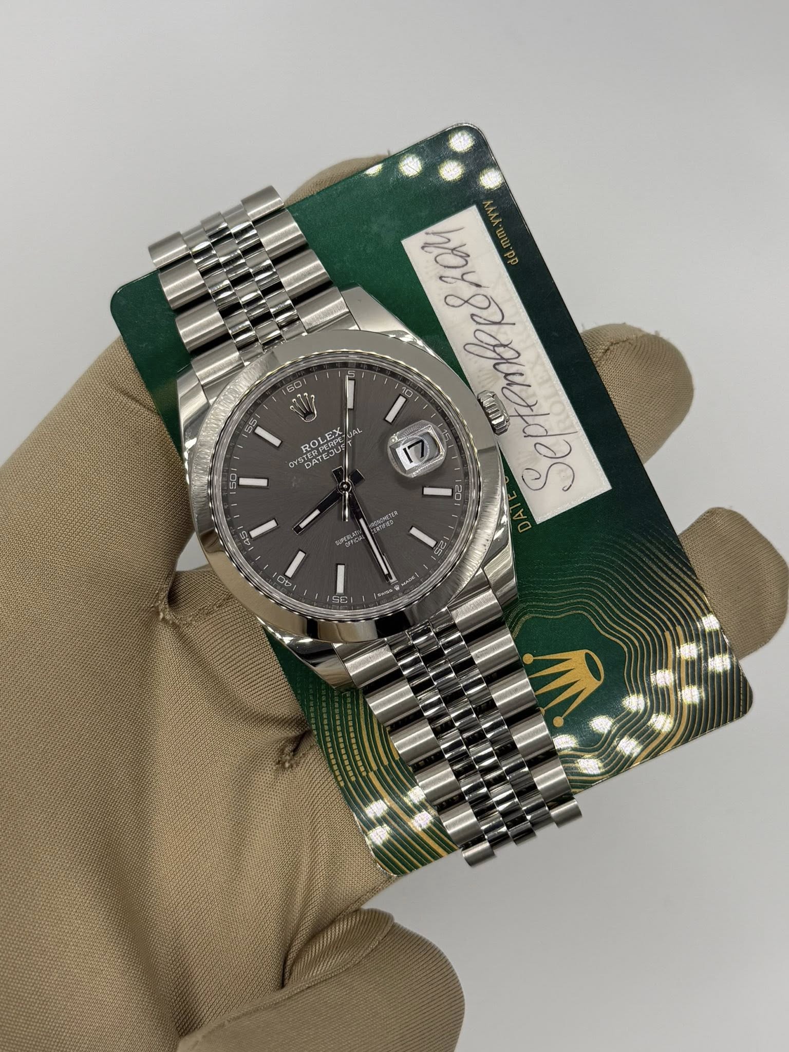 May be an image of wrist watch and text