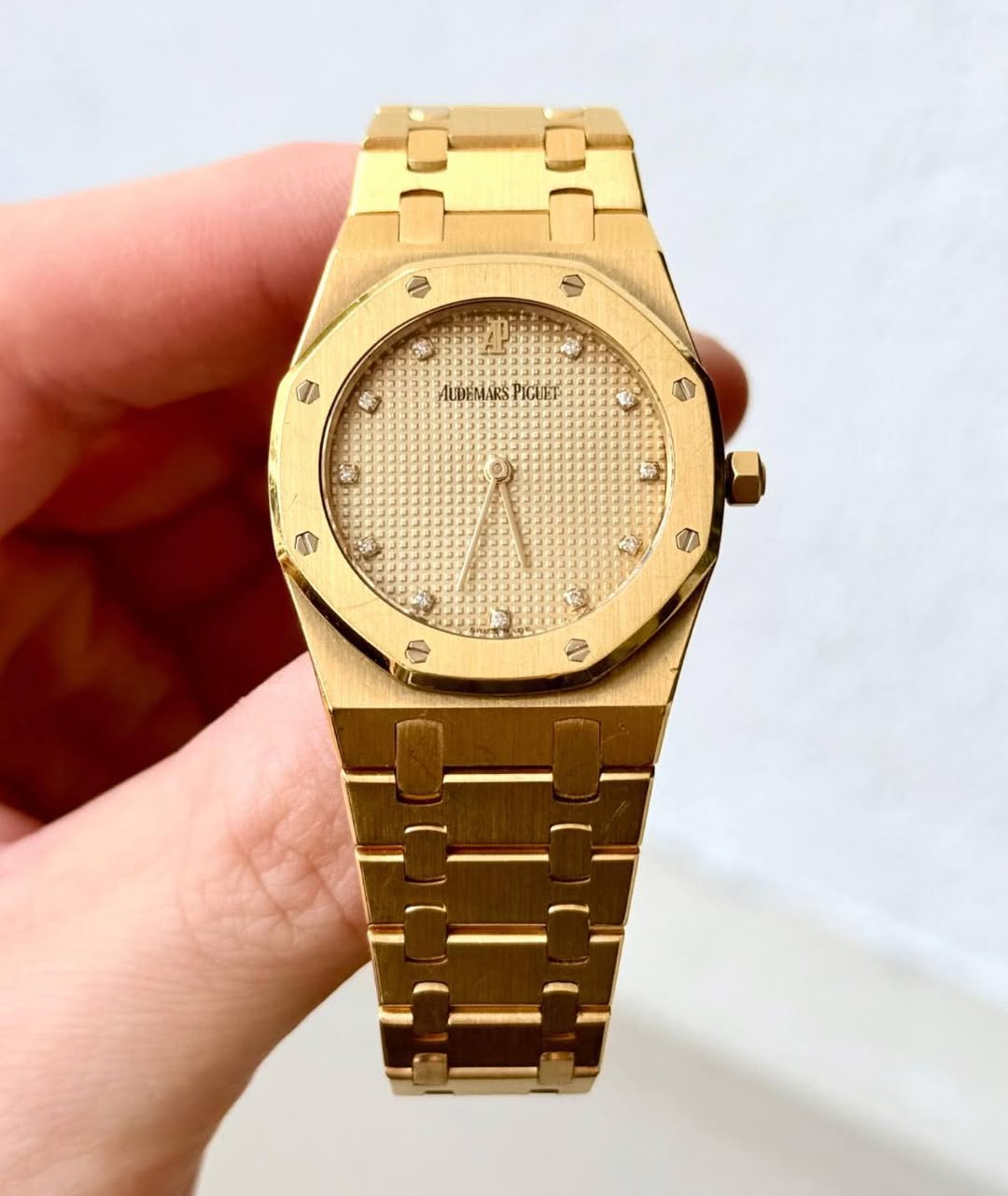 May be an image of wrist watch and text
