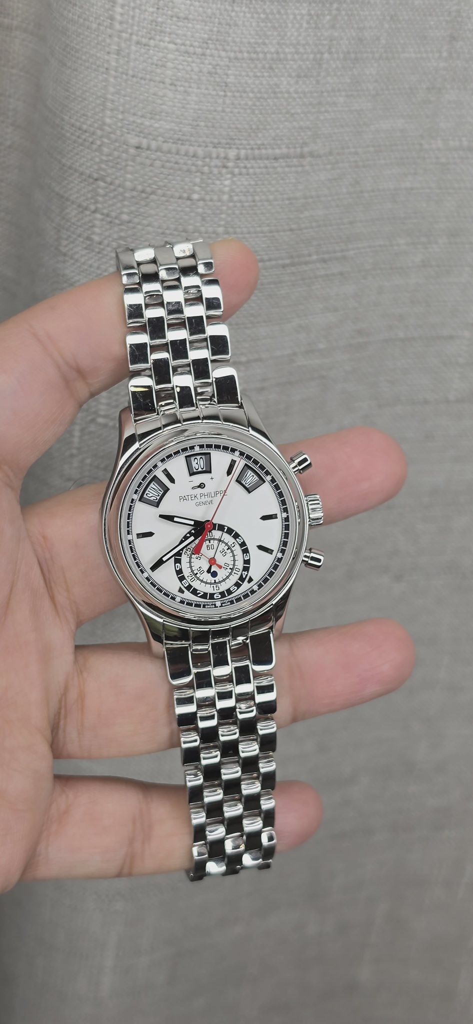 May be an image of wrist watch and text