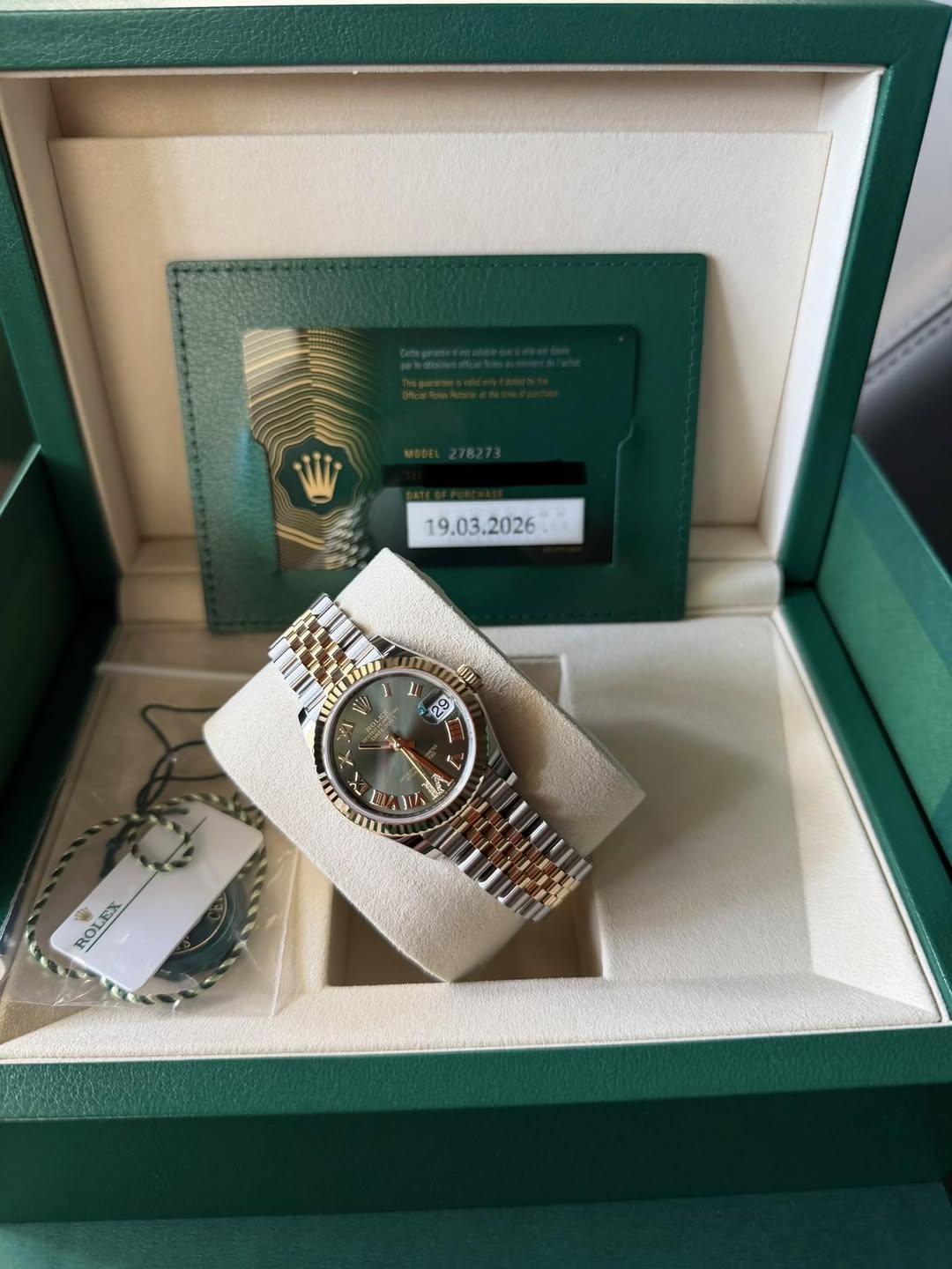 May be an image of wrist watch and text
