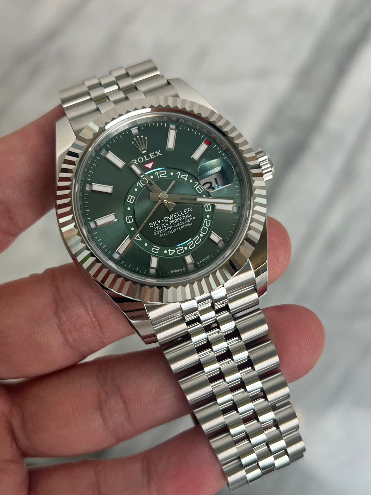 May be an image of wrist watch and text
