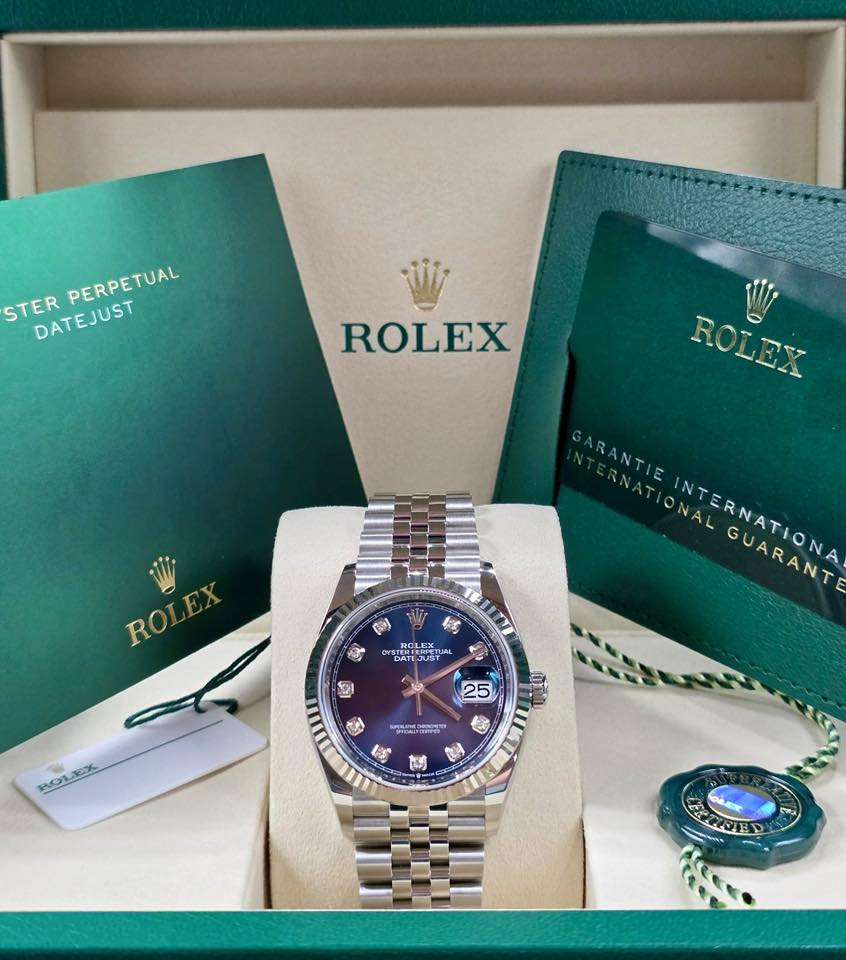May be an image of wrist watch and text that says 'STER STERPERPETUAL DATEJUST PERPETUAL ROLEX ROLEX ARANTIE ONAL INTERNATIONA VARANT ROLEX ROLEX 動 ROLEX OYSTN YSTERENOENT ים 25…