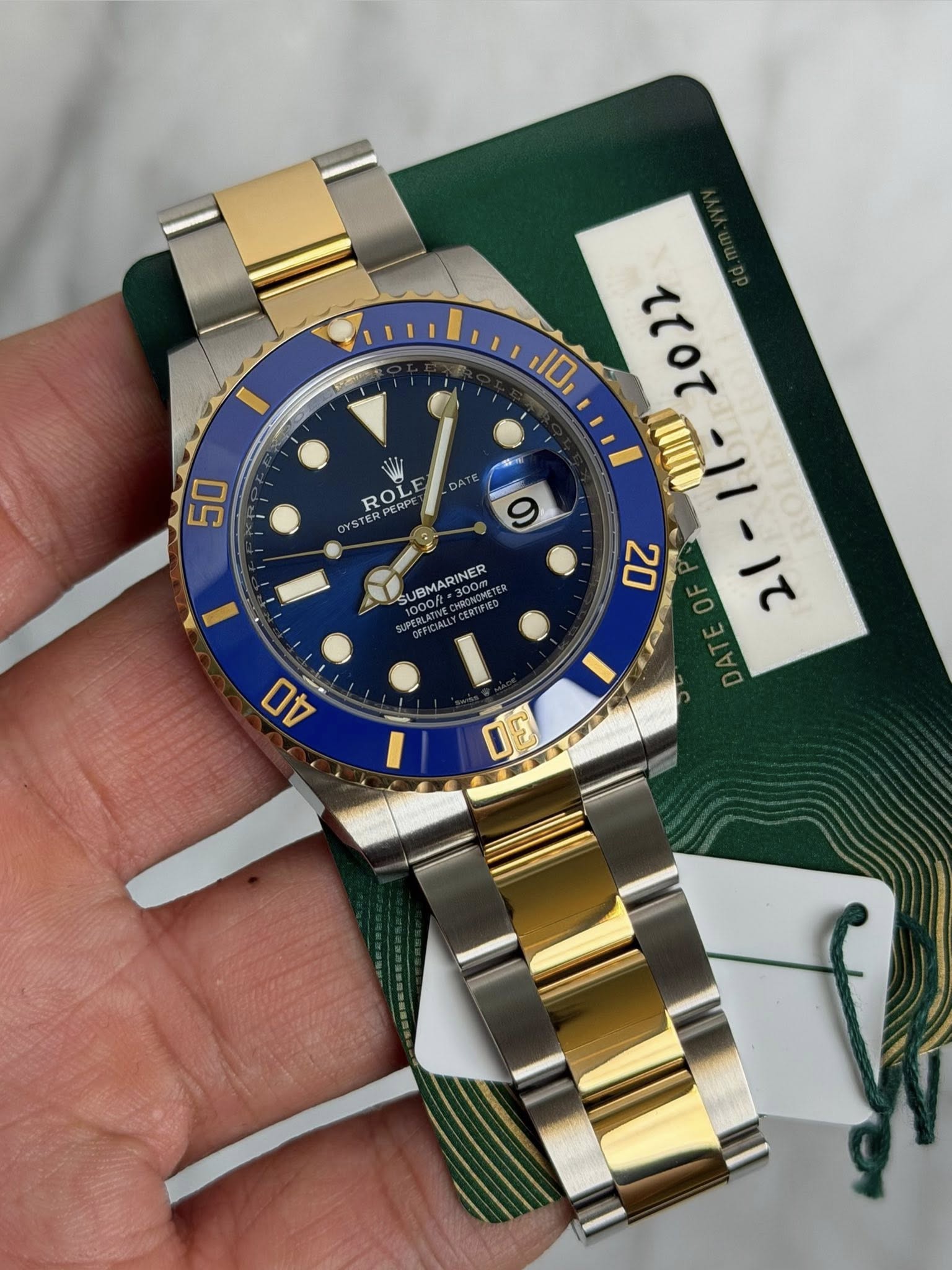 May be an image of wrist watch and text that says '10 50 ROL RPERPE STER 55 DAT 9 JBMARINER 300m MTE 70י ? 20 סן- 3 DE 40 50'