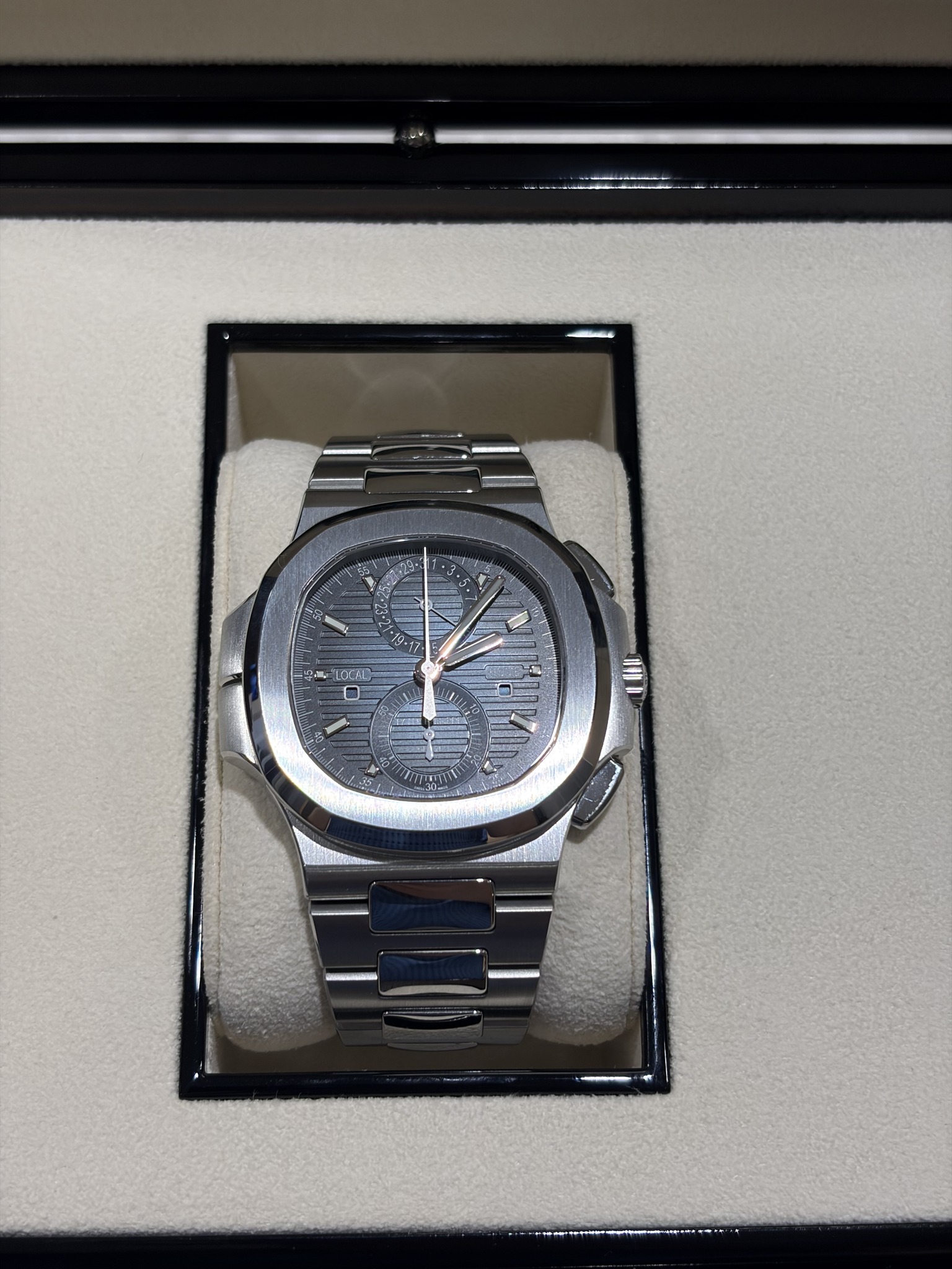 May be an image of wrist watch and text