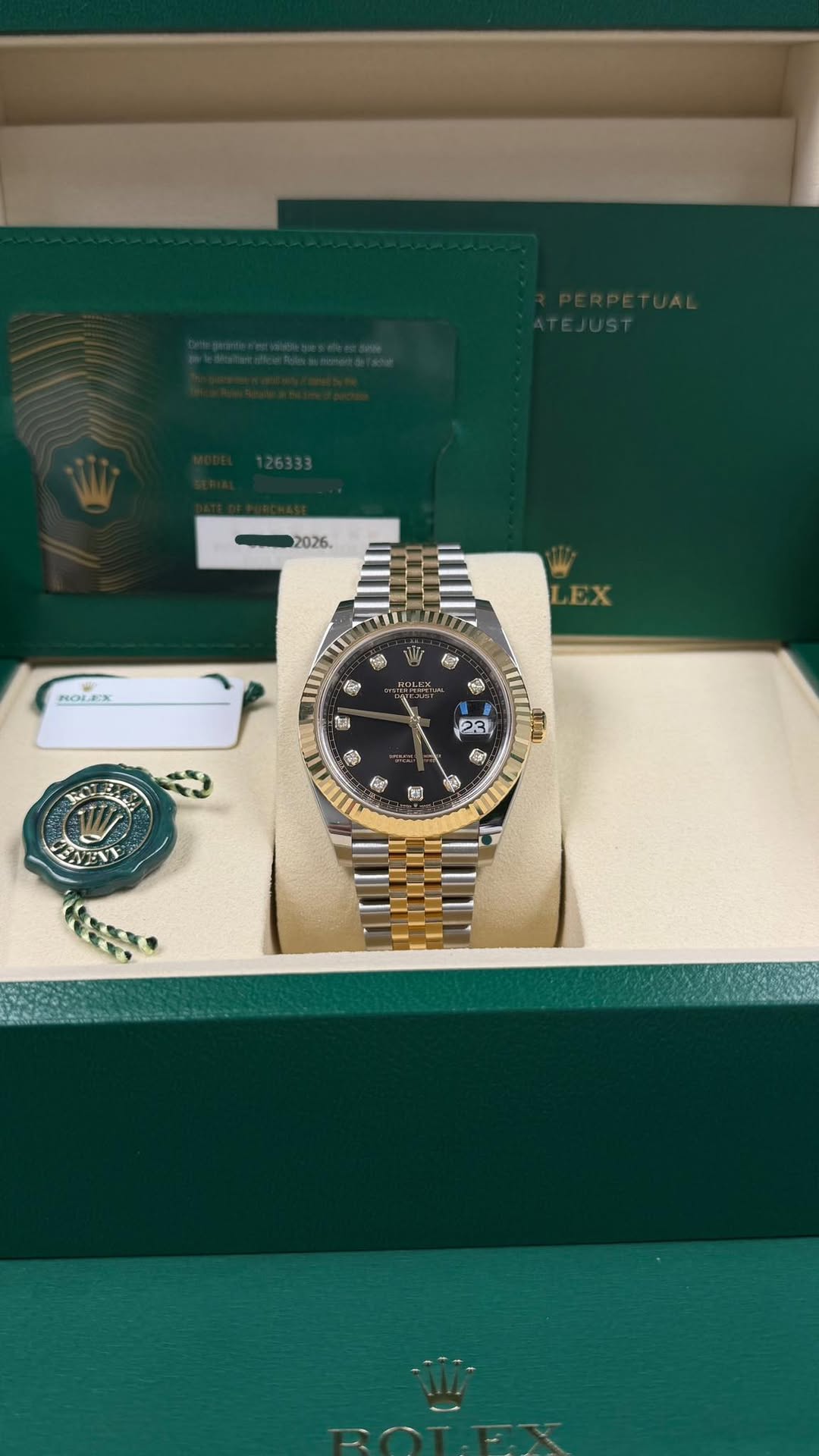 May be an image of wrist watch and text