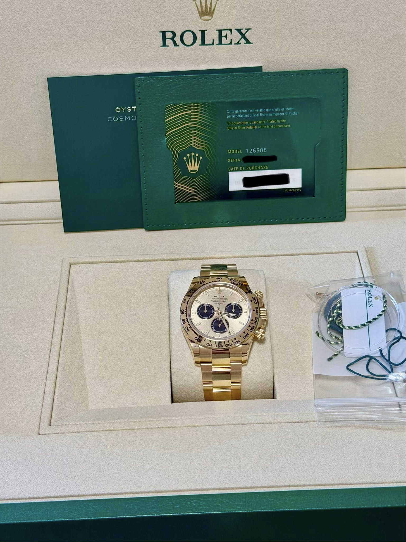 May be an image of wrist watch and text that says 'ROLEX OYST COSMO eA 126508 امتمم 目'